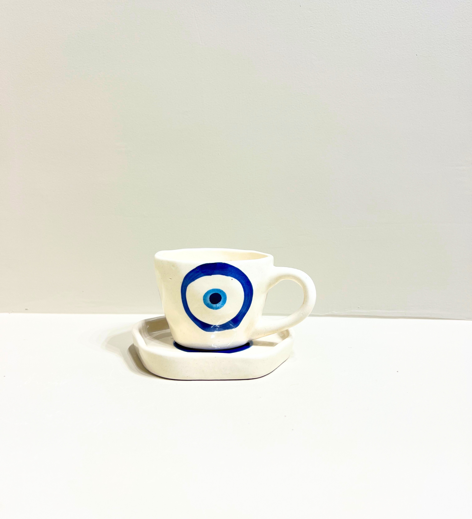 Midnight Nazar – Evil Eye Ceramic Mug & Plate Set by Aetherea World with at Kamakhyaa for sustainable fashion