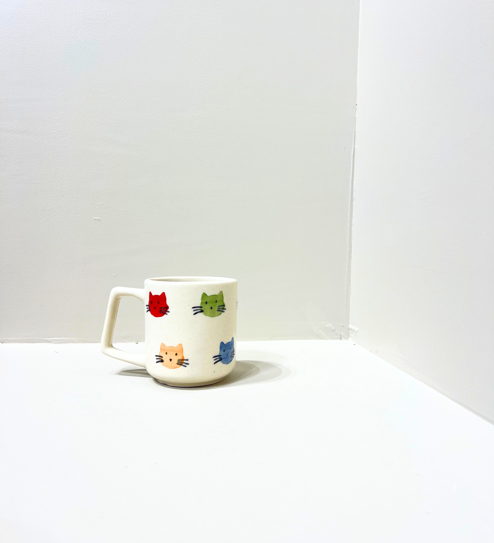Purrfect Companions – Hand-Painted Kitty Face Mug by Aetherea World with at Kamakhyaa for sustainable fashion