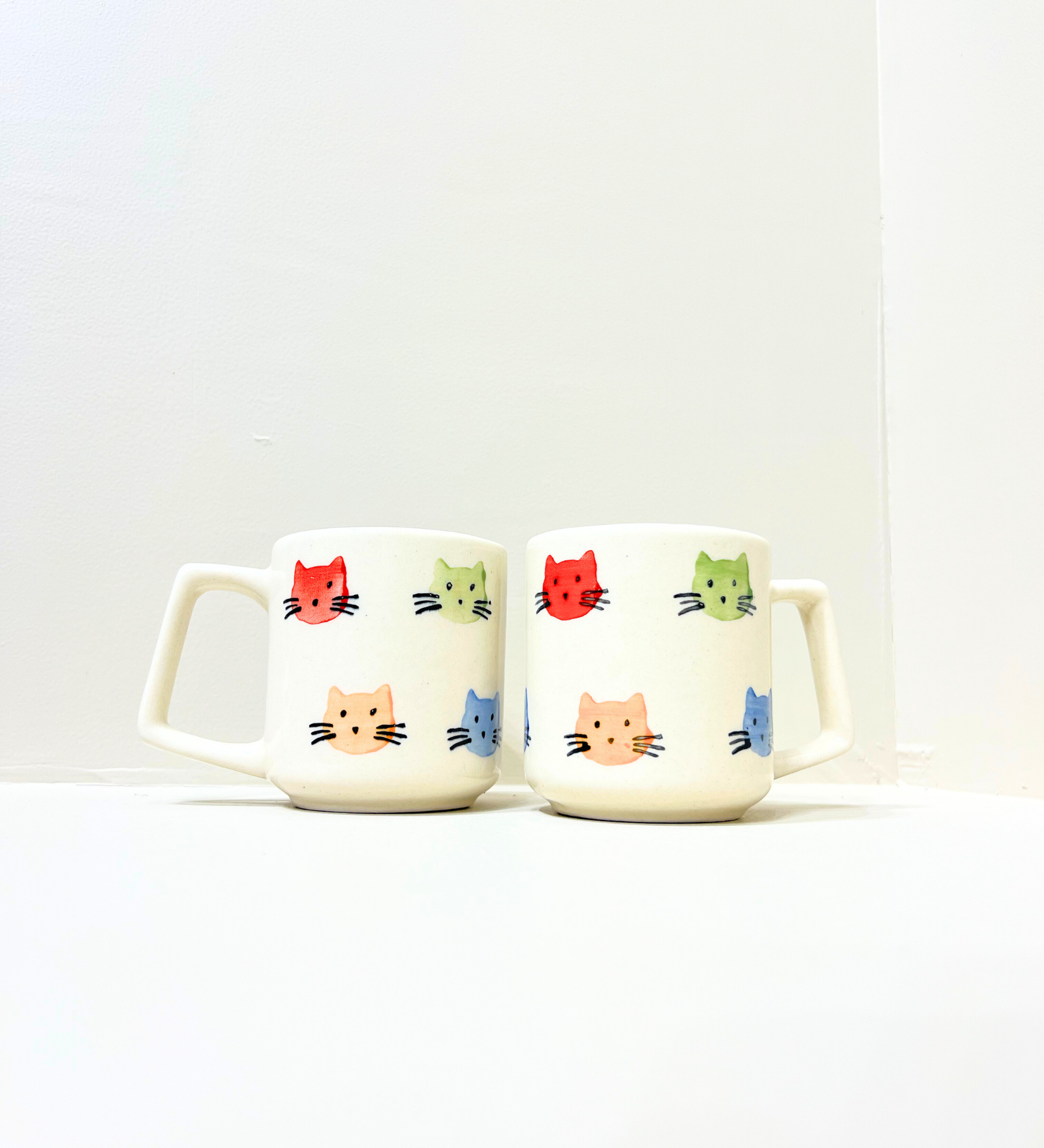 Purrfect Companions – Hand-Painted Kitty Face Mug by Aetherea World with at Kamakhyaa for sustainable fashion