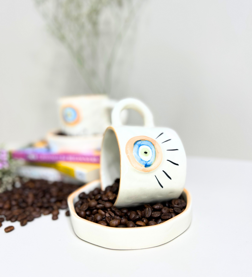 Sunstone Gaze – Evil Eye Ceramic Mug & Plate Set by Aetherea World with at Kamakhyaa for sustainable fashion