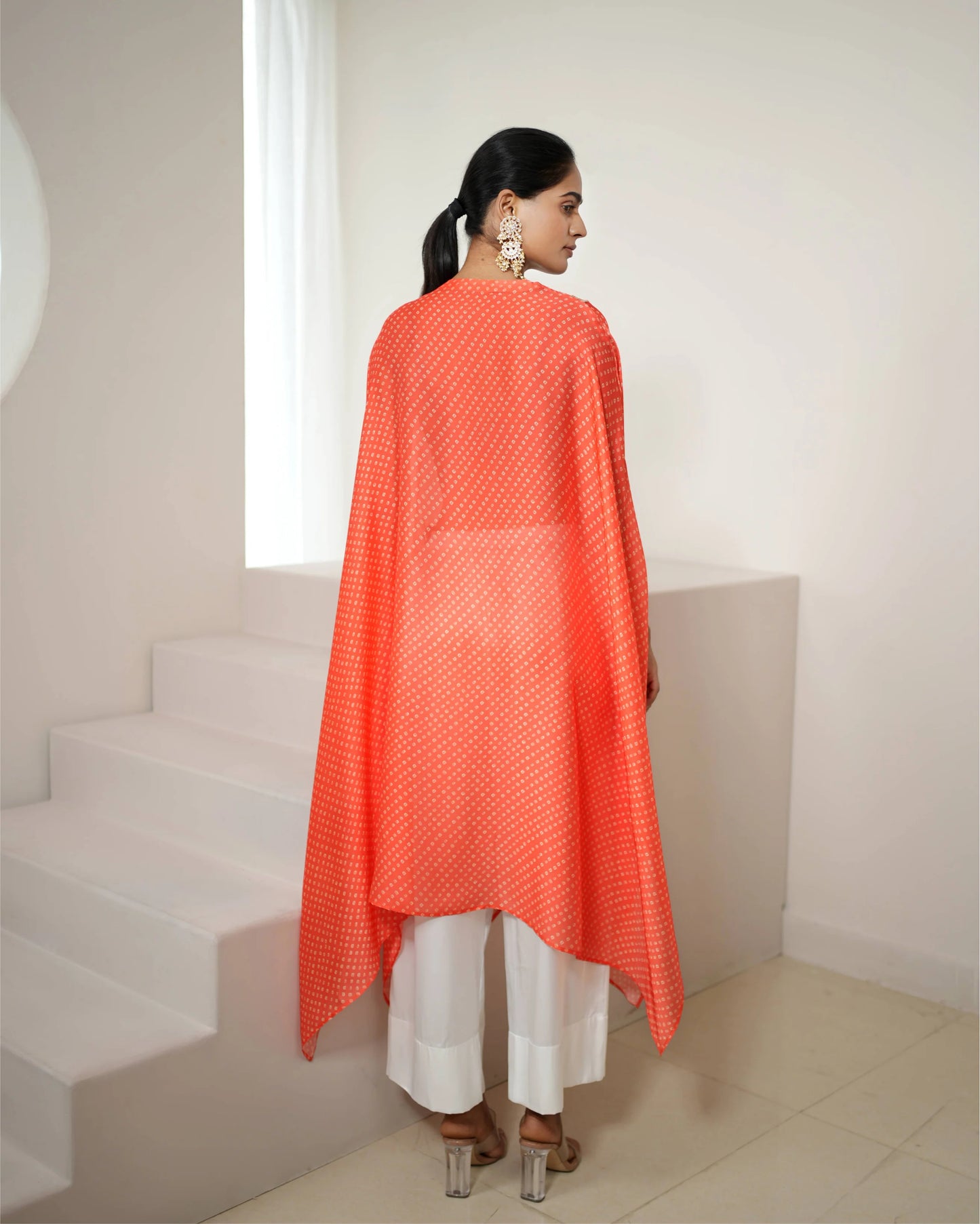 Orange Cowl Neck Bandhej Print Kurta Pant Set by Mayura Kumar with Bandhej, Bandhej Bandhini Mixology by Mayura Kumar, Dry clean, Festive Wear, Orange, Relaxed Fit, Satin Silk, Tie-Dye at Kamakhyaa for sustainable fashion