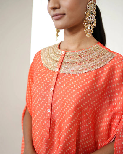 Orange Cowl Neck Bandhej Print Kurta Pant Set by Mayura Kumar with Bandhej, Bandhej Bandhini Mixology by Mayura Kumar, Dry clean, Festive Wear, Orange, Relaxed Fit, Satin Silk, Tie-Dye at Kamakhyaa for sustainable fashion