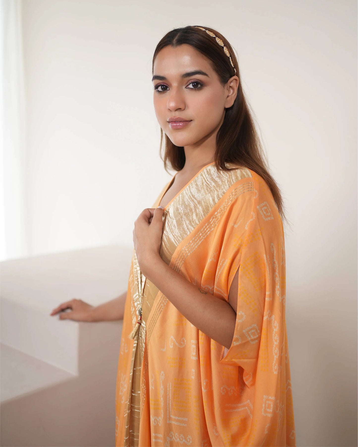 Peach Zari Weave Free Size Kaftan by Mayura Kumar with Bandhej, Bandhej Bandhini Mixology by Mayura Kumar, Dry clean, Festive Wear, Modal, Modal Satin Silk, Pink, Relaxed Fit, Satin Silk, Silk, Tie-Dye at Kamakhyaa for sustainable fashion