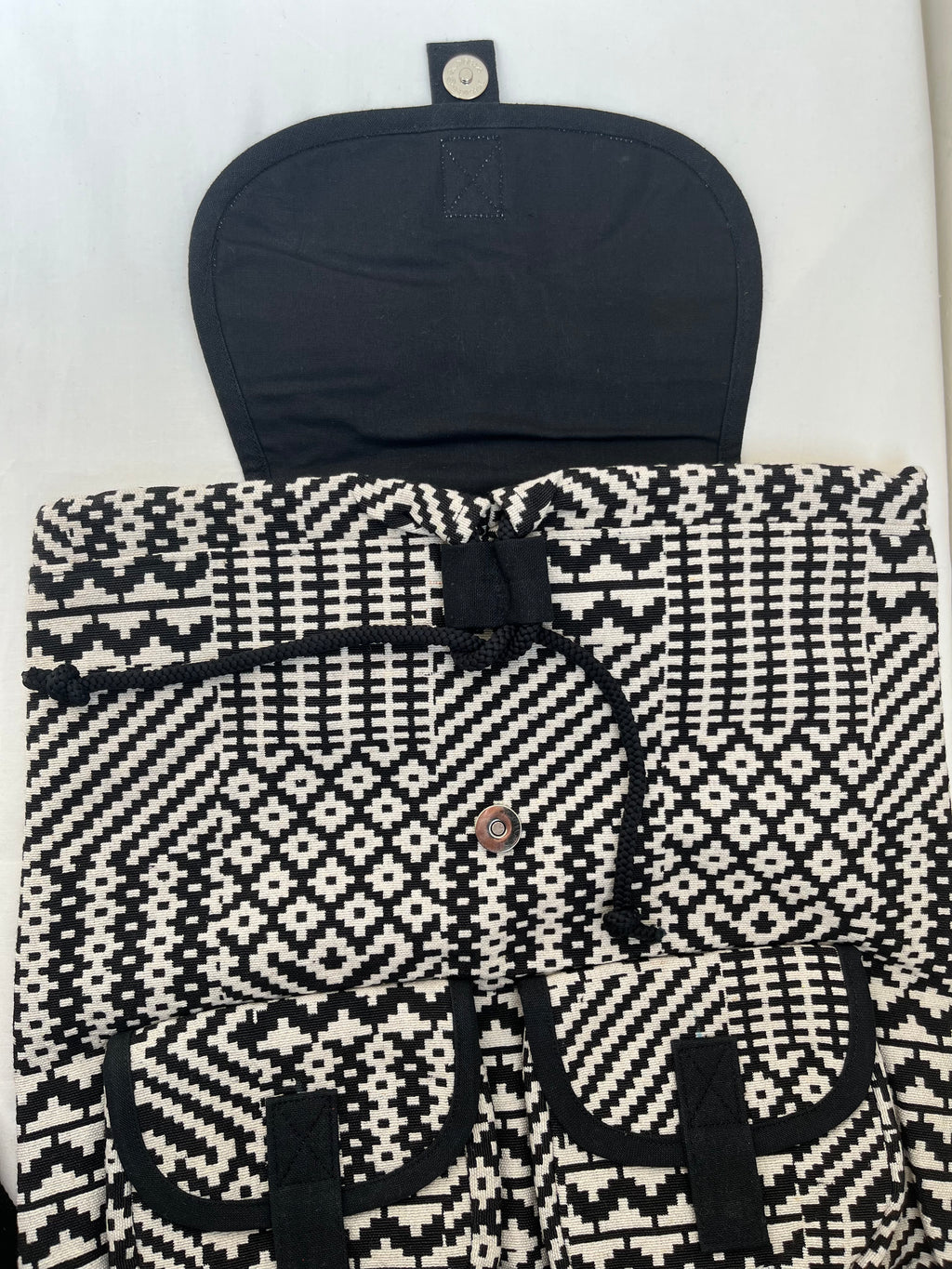 Black and White Drawstring Bag by Discarded Fresh Bags with at Kamakhyaa for sustainable fashion