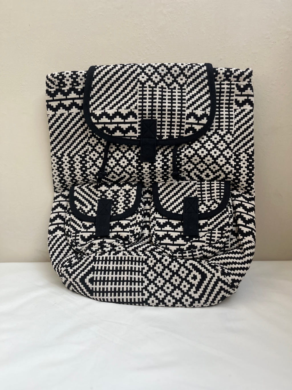 Black and White Drawstring Bag by Discarded Fresh Bags with at Kamakhyaa for sustainable fashion