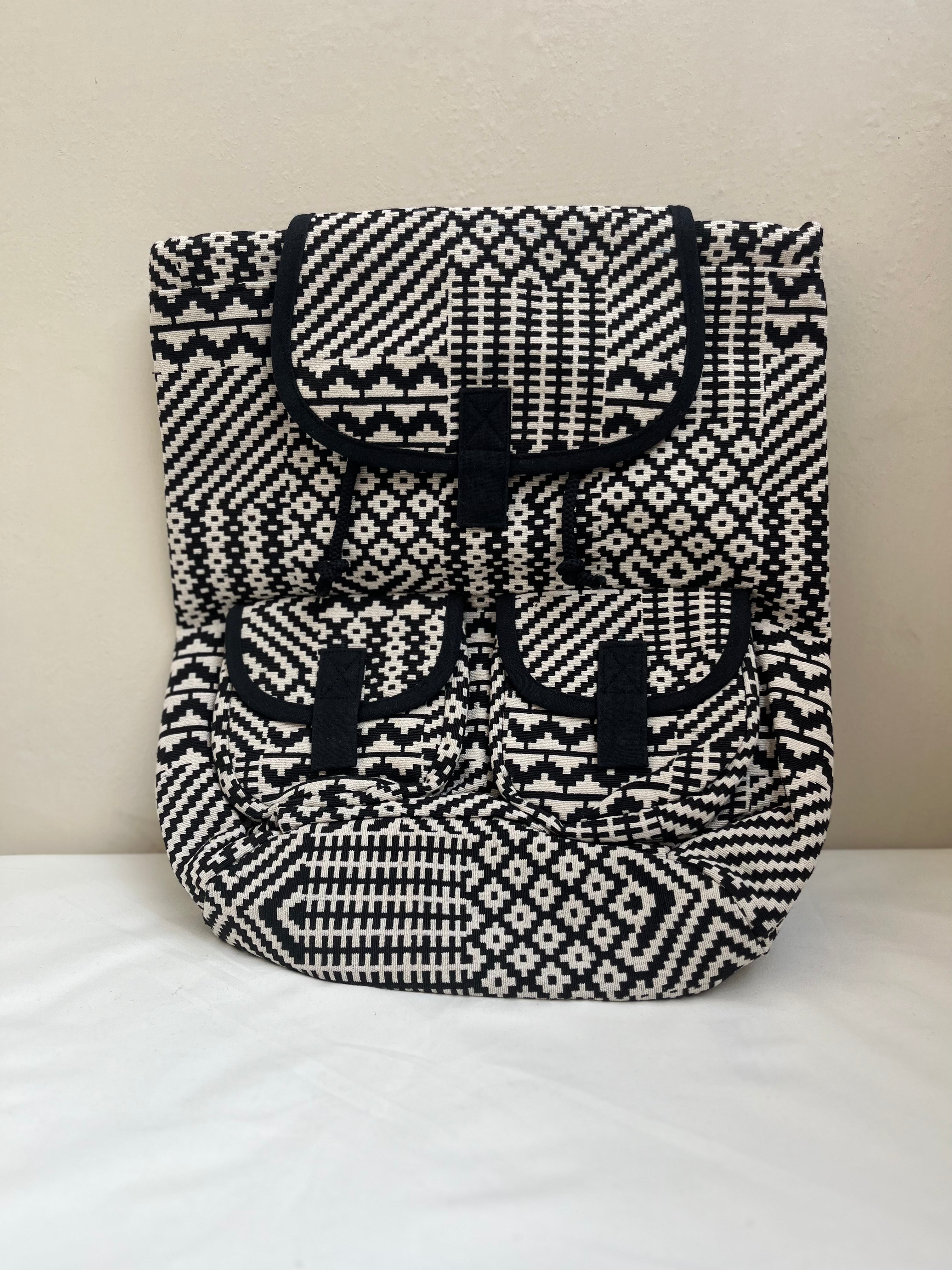 Black and White Drawstring Bag by Discarded Fresh Bags with at Kamakhyaa for sustainable fashion