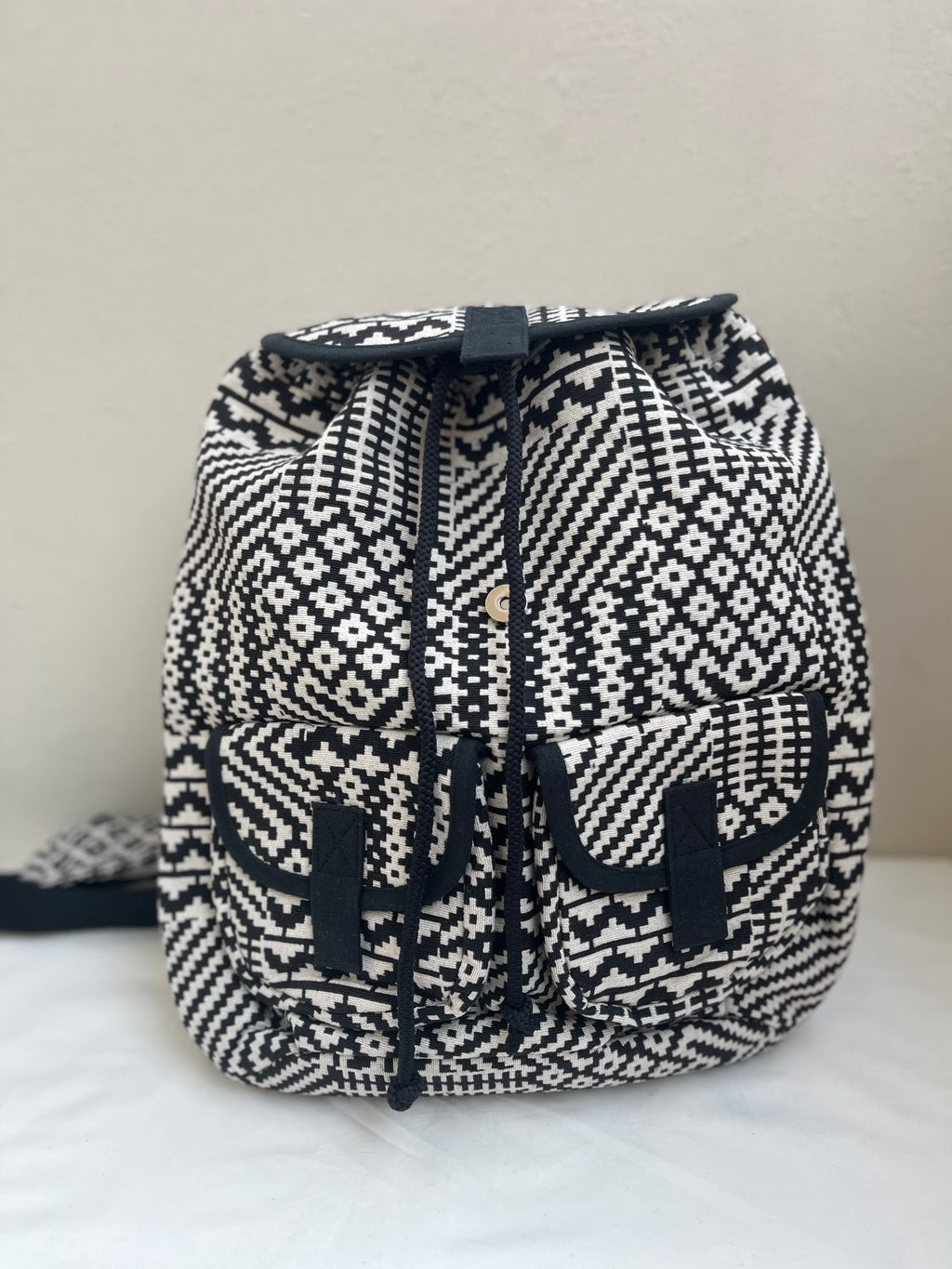 Black and White Drawstring Bag by Discarded Fresh Bags with at Kamakhyaa for sustainable fashion