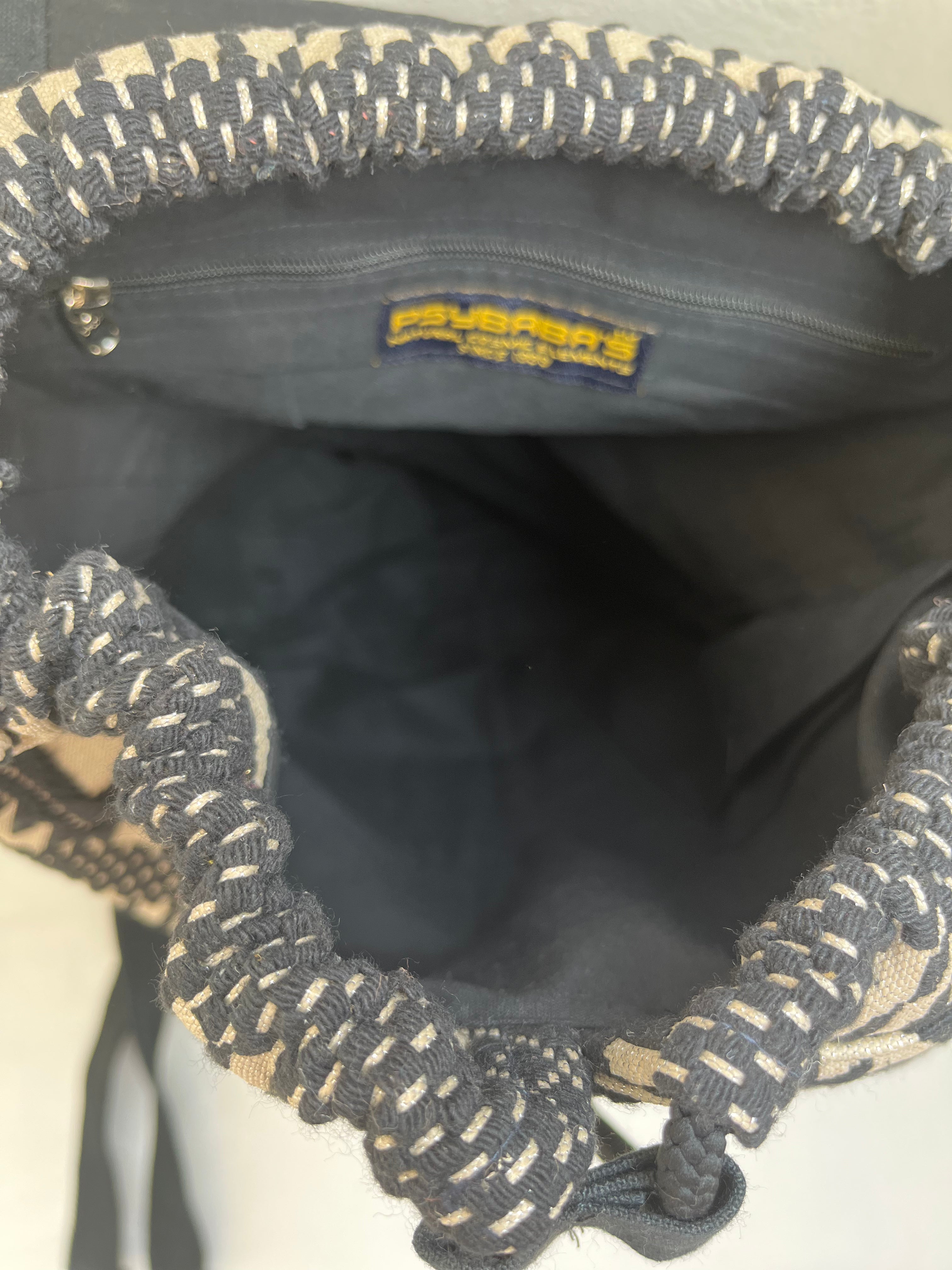 Black and White Drawstring Bag by Discarded Fresh Bags with at Kamakhyaa for sustainable fashion