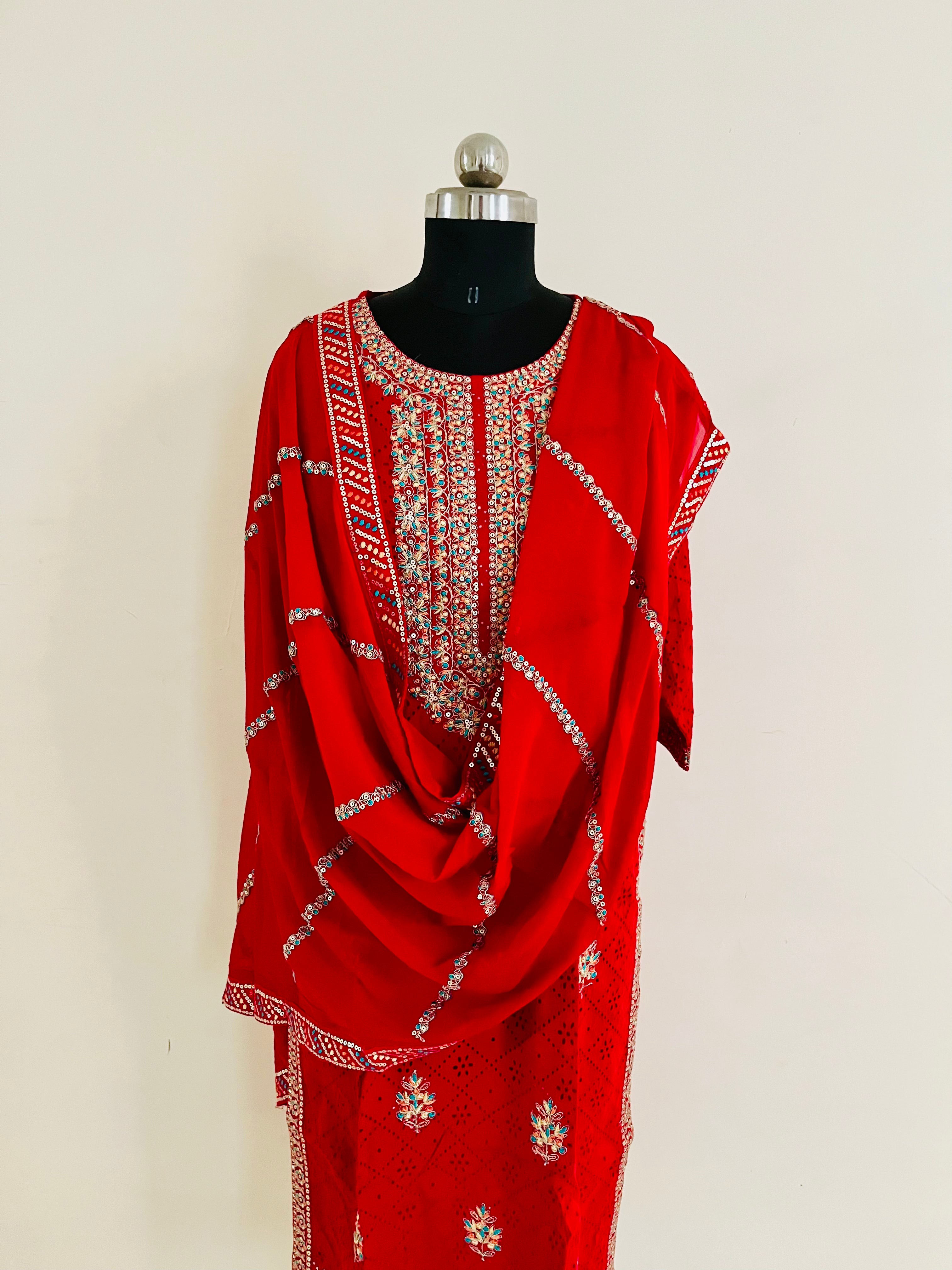 Red Cotton Cutwork Kurta Set With Dupatta by Indian Wear with Cotton, Cutwork, Ethnic Wear, Kurta Pant Sets, Kurta Set with Dupattas, Natural, Red, Regular Fit, Womenswear at Kamakhyaa for sustainable fashion