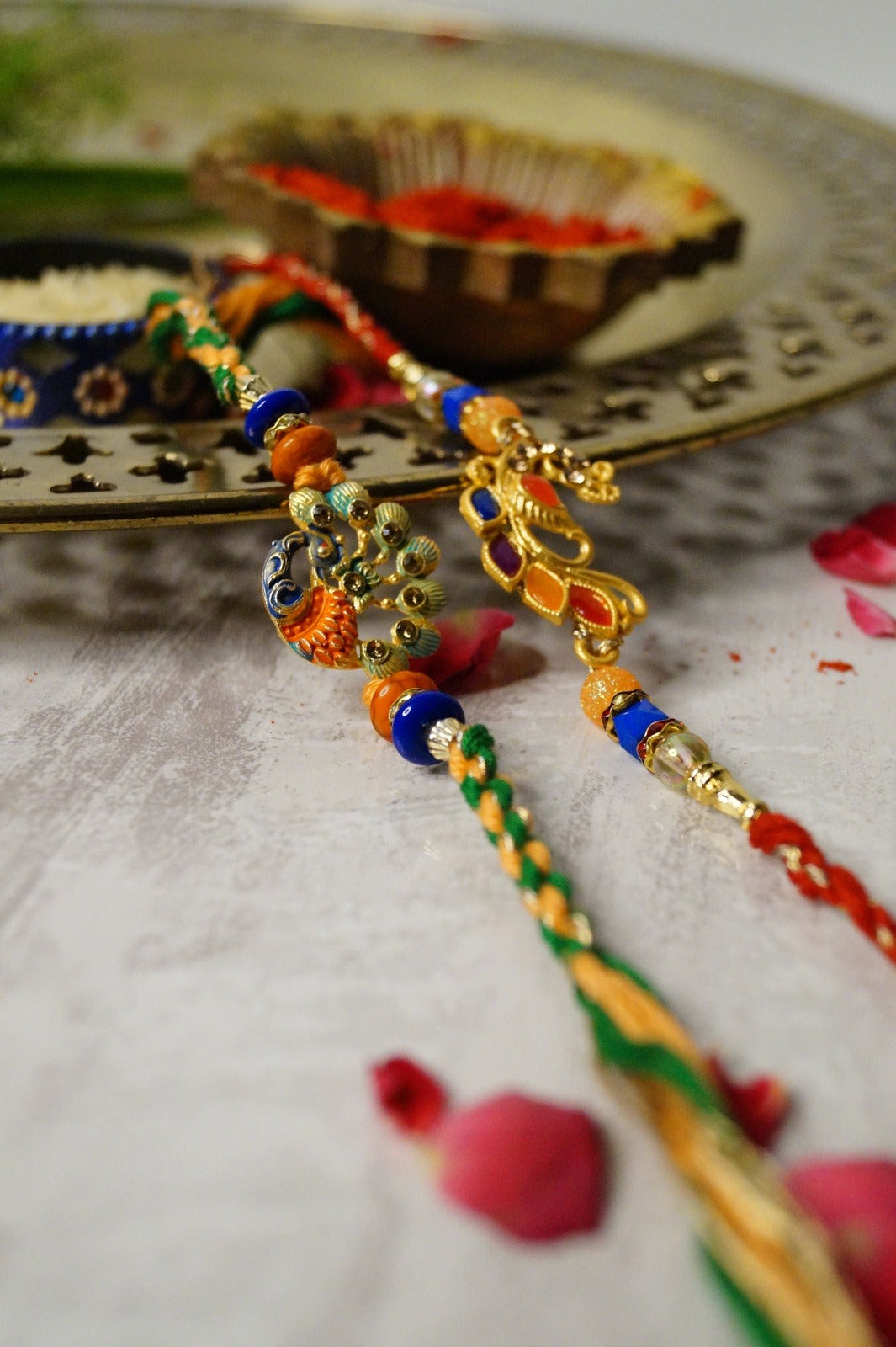 Peacock Stone and Colorful Stone Thread Rakhi by Kamakhyaa with Festive Wear, Jewellery, Multicolor, Natural Materials, Natural Threads, Peacock, Rakhi, Rakhis Ready to Ship, Regular Fit, Upcycled, Zari Threads at Kamakhyaa for sustainable fashion