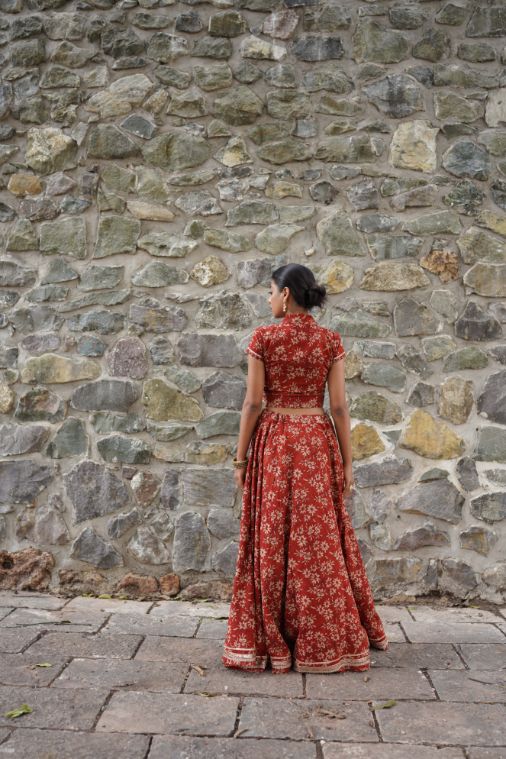 Red Hand Block Printed Lehenga Set by Hasttvam with Cotton, Festive Wear, Floral, Handmade by Artisans, Natural dyes, Navratri, Navratri Teens, Rang by Hasttvam, Red, Relaxed Fit, Respondible production and Vegan at Kamakhyaa for sustainable fashion