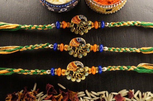 Set of 3-Peacock Stone Thread Rakshi by Kamakhyaa with Festive Wear, Jewellery, Multicolor, Natural Materials, Natural Threads, Peacock, Rakhi, Rakhis Ready to Ship, Regular Fit, Upcycled, Zari Threads at Kamakhyaa for sustainable fashion