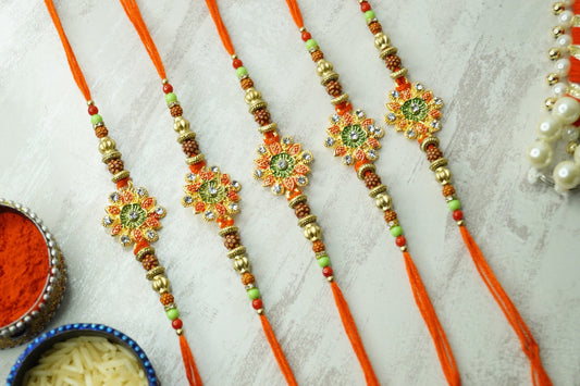 Set of 5-Floral Rudraksh Thread Rakhi by Kamakhyaa with Festive Wear, Floral, Jewellery, Natural Materials, Natural Threads, Rakhi, Rakhis Ready to Ship, Red, Regular Fit, Upcycled, Zari Threads at Kamakhyaa for sustainable fashion