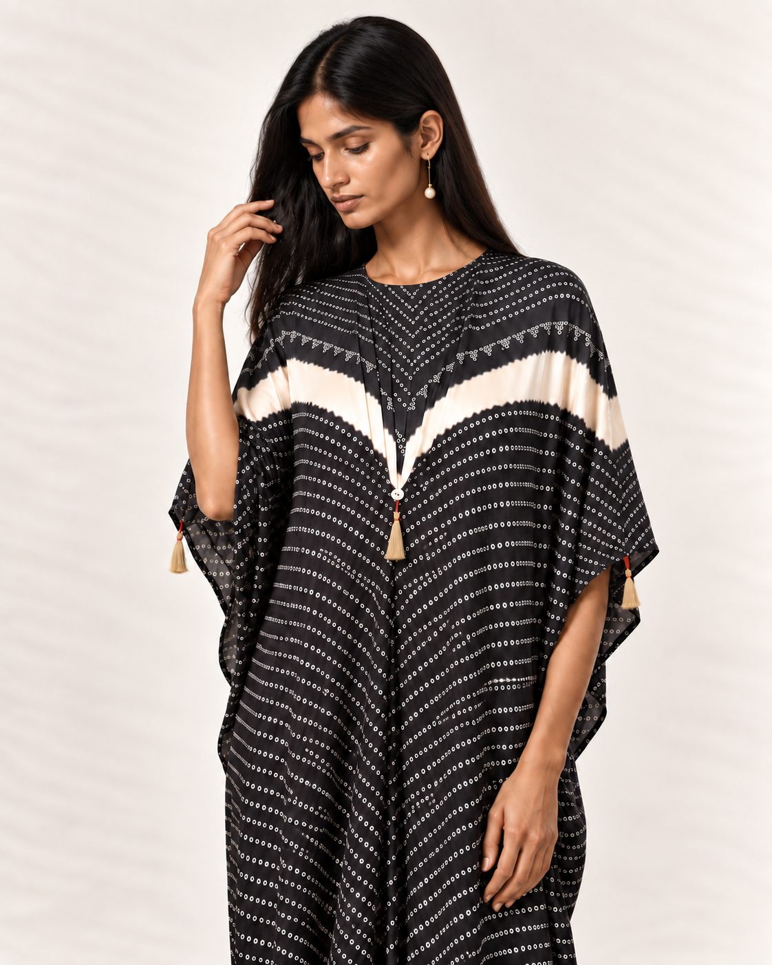 Charcoal, ivory and black Bandhej kaftan on model, three-quarter detail view