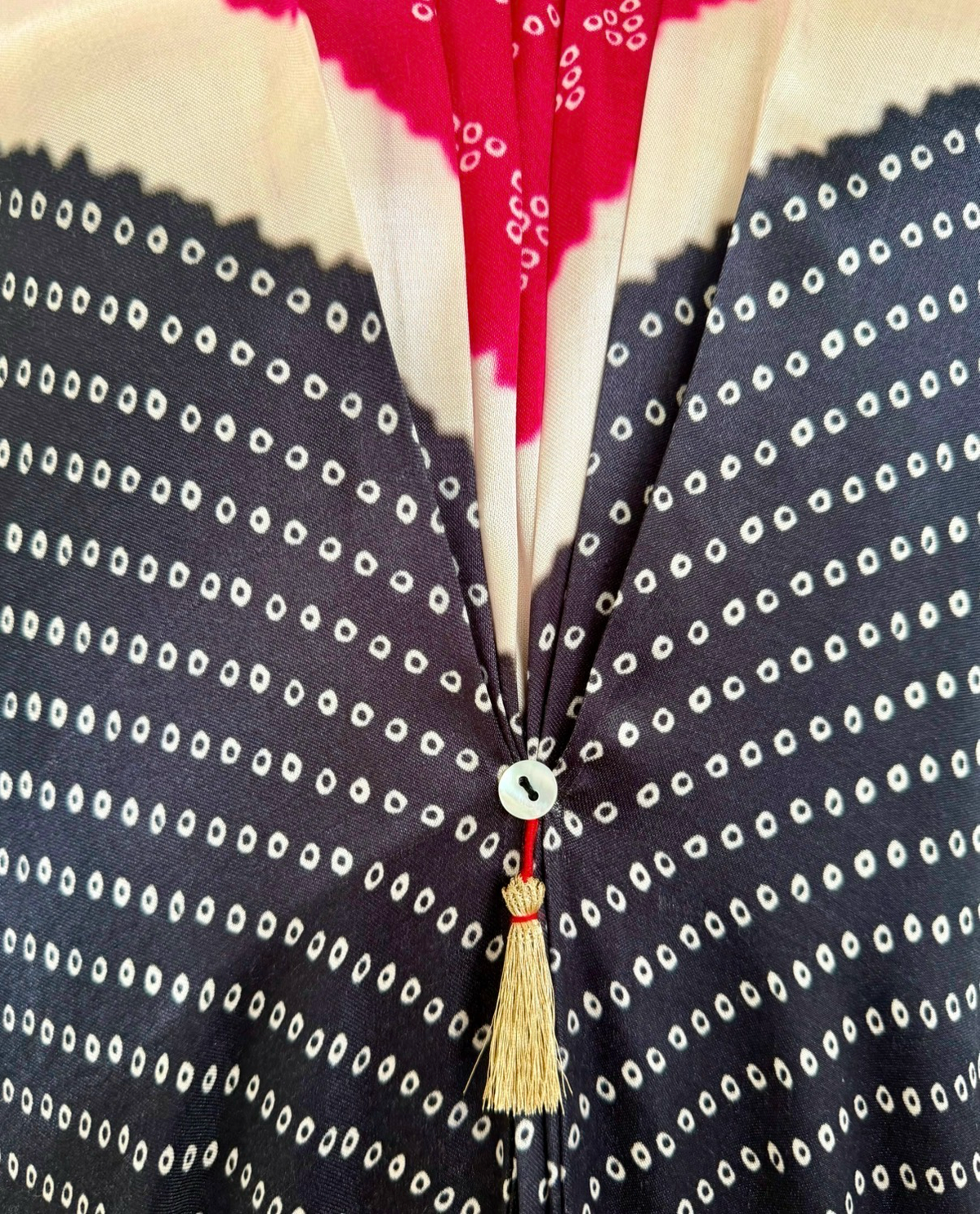 Pink, ivory and black Bandhej kaftan fabric detail