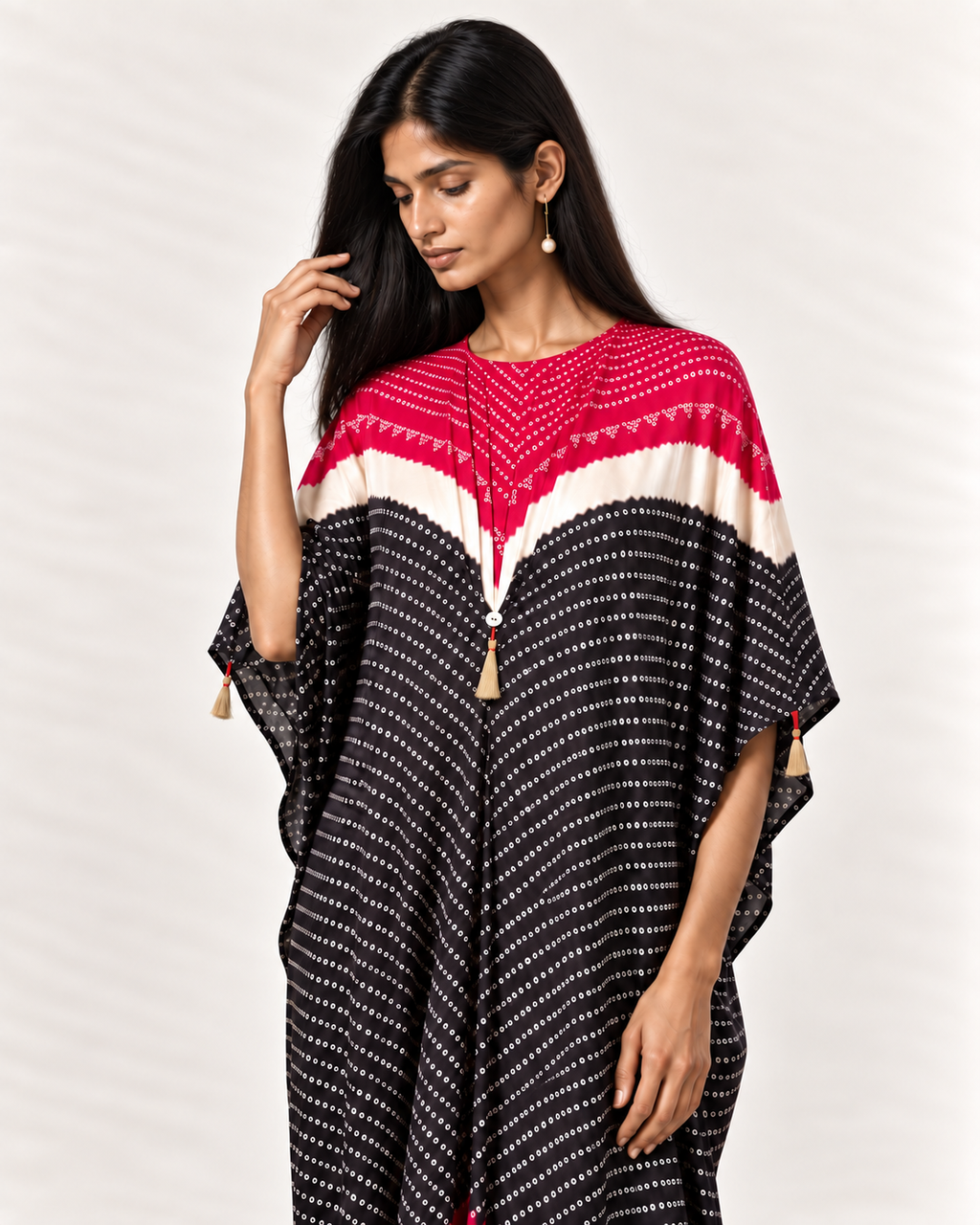 Pink, ivory and black Bandhej kaftan on model, three-quarter detail view