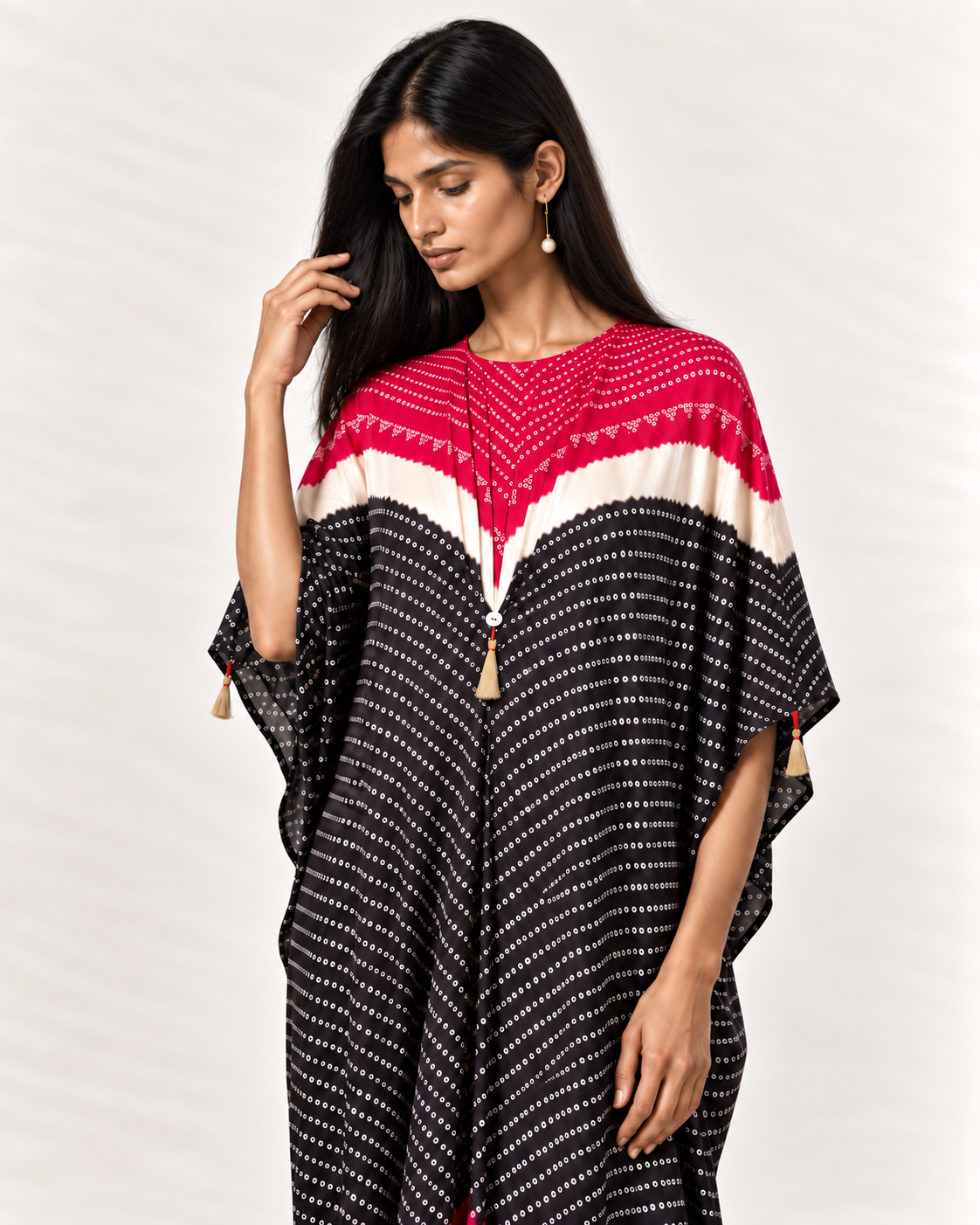 Pink, ivory and black Bandhej kaftan on model, three-quarter detail view