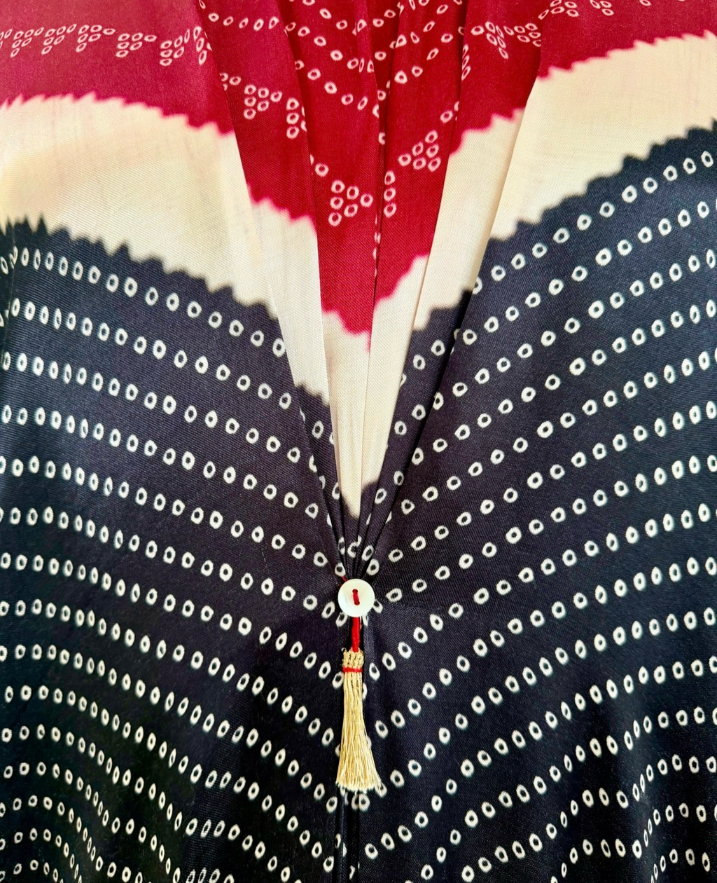 Red, ivory and black Bandhej kaftan fabric detail