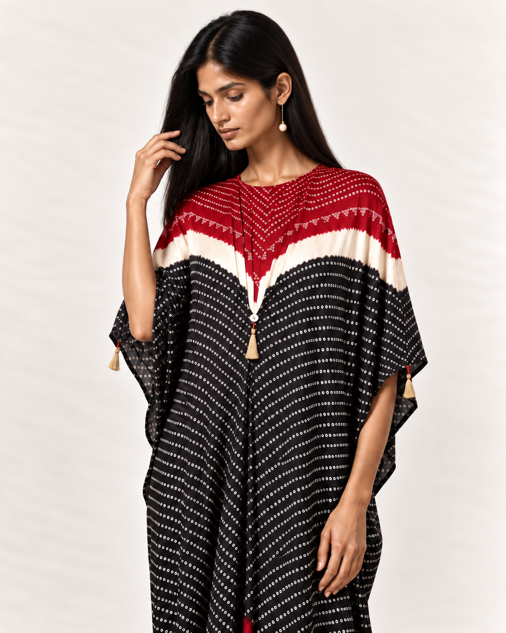 Red, ivory and black Bandhej kaftan on model, three-quarter detail view