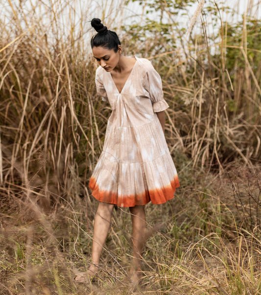 Beige shibori dyed ikkat Mini Dress by Khara Kapas with Beige, Cotton, Handwoven, Ikat Print, Lost & Found by Khara Kapas, Natural, Ombre & Dyes, Regular Fit, Resort Wear, Tiered Dresses, Womenswear at Kamakhyaa for sustainable fashion