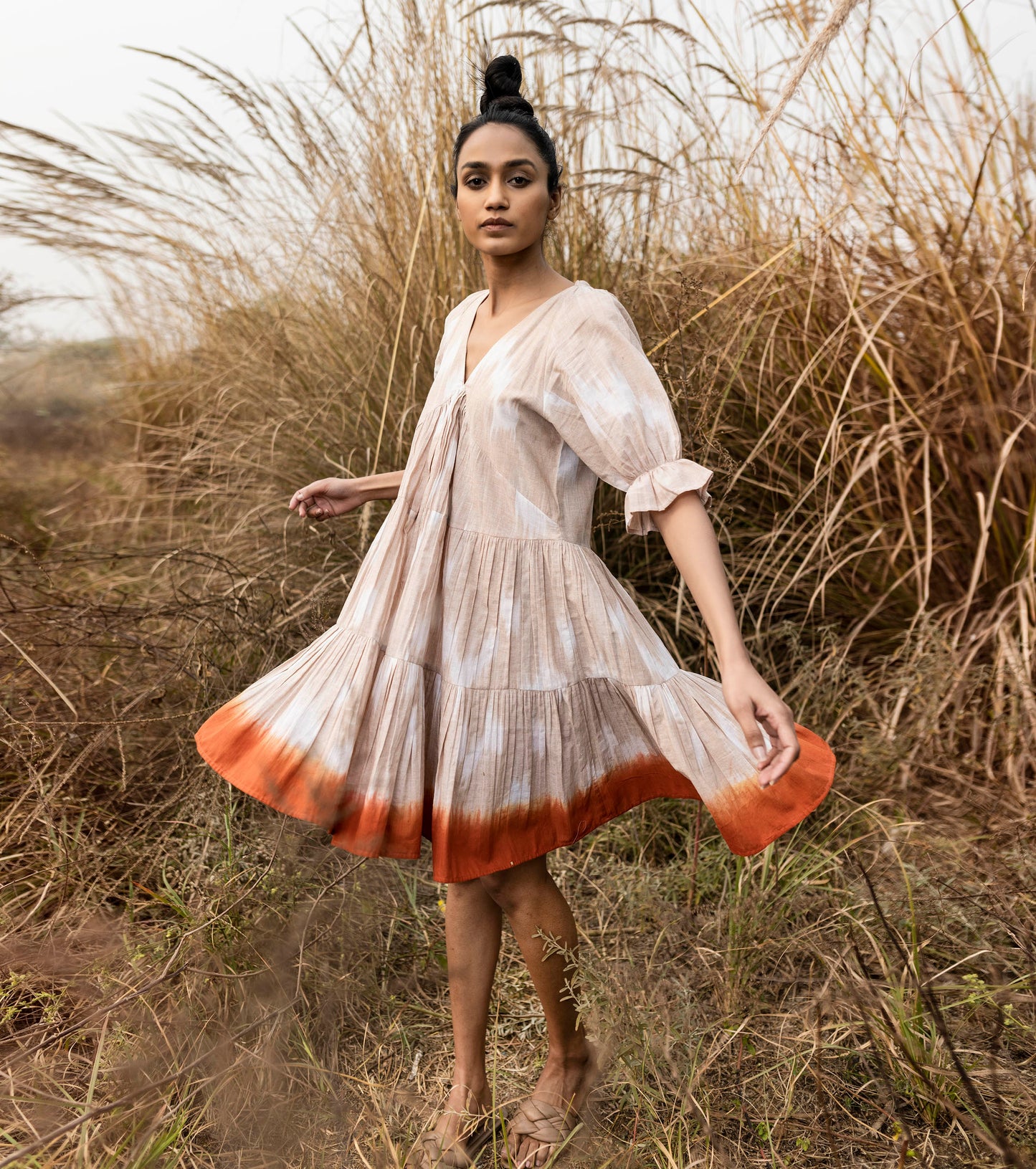 Beige shibori dyed ikkat Mini Dress by Khara Kapas with Beige, Cotton, Handwoven, Ikat Print, Lost & Found by Khara Kapas, Natural, Ombre & Dyes, Regular Fit, Resort Wear, Tiered Dresses, Womenswear at Kamakhyaa for sustainable fashion