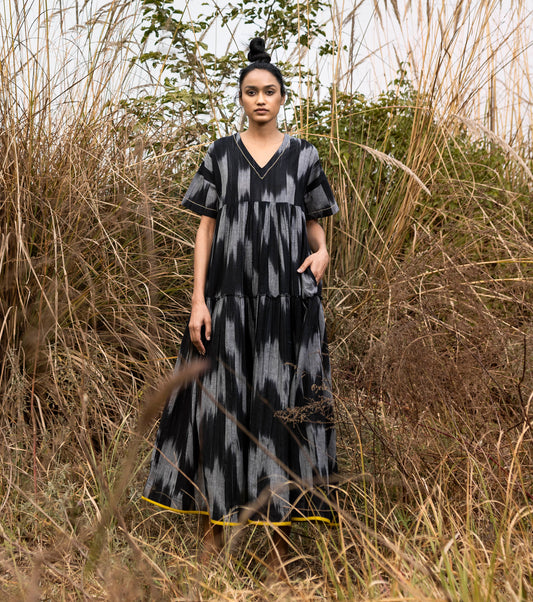 Black Ikat Tier Dress by Khara Kapas with Black, Cotton, For Anniversary, Handloom Cotton, Ikat Print, Lost & Found by Khara Kapas, Natural, Regular Fit, Resort Wear, Selfsame, Textured, Tiered Dresses, Womenswear at Kamakhyaa for sustainable fashion