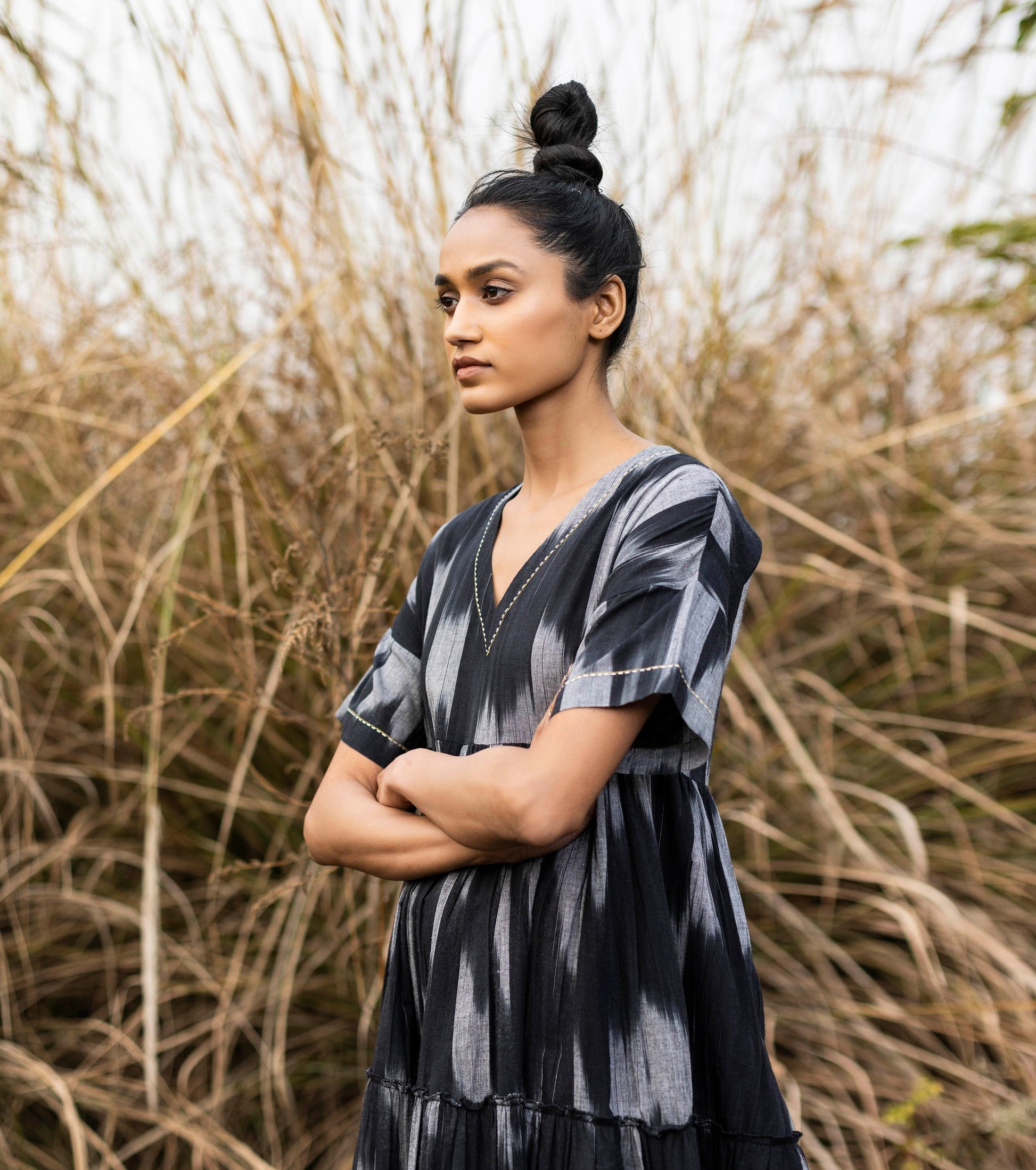 Black Ikat Tier Dress by Khara Kapas with Black, Cotton, For Anniversary, Handloom Cotton, Ikat Print, Lost & Found by Khara Kapas, Natural, Regular Fit, Resort Wear, Selfsame, Textured, Tiered Dresses, Womenswear at Kamakhyaa for sustainable fashion