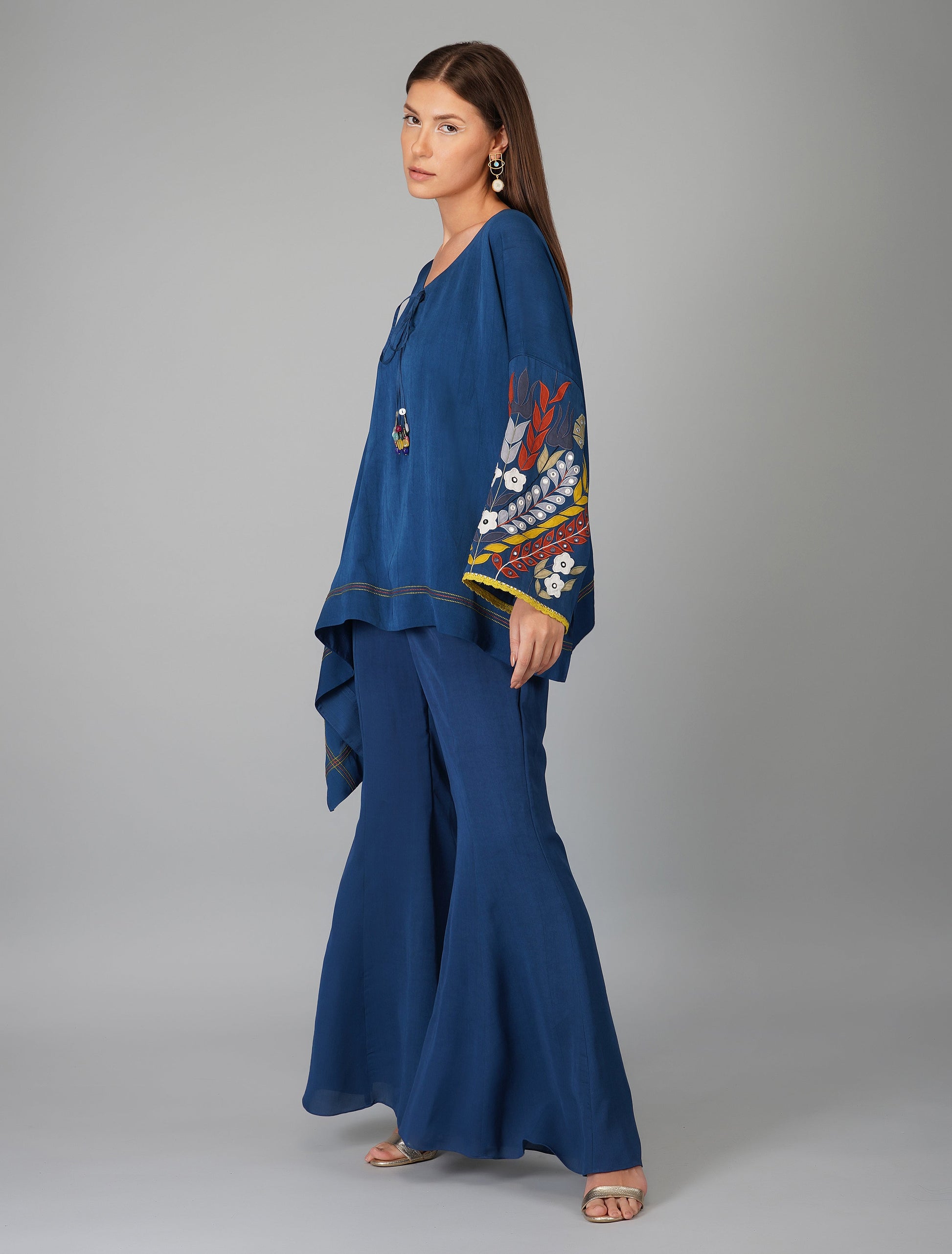 Blue Hand Embroidered Applique Cape Set by Devyani Mehrotra with Blue, Co-ord Sets, Embroidered, Evening Wear, Georgette, Natural, Patchwork, Pre Spring 2023, Relaxed Fit, Travel Co-ords, Viscose, Womenswear at Kamakhyaa for sustainable fashion