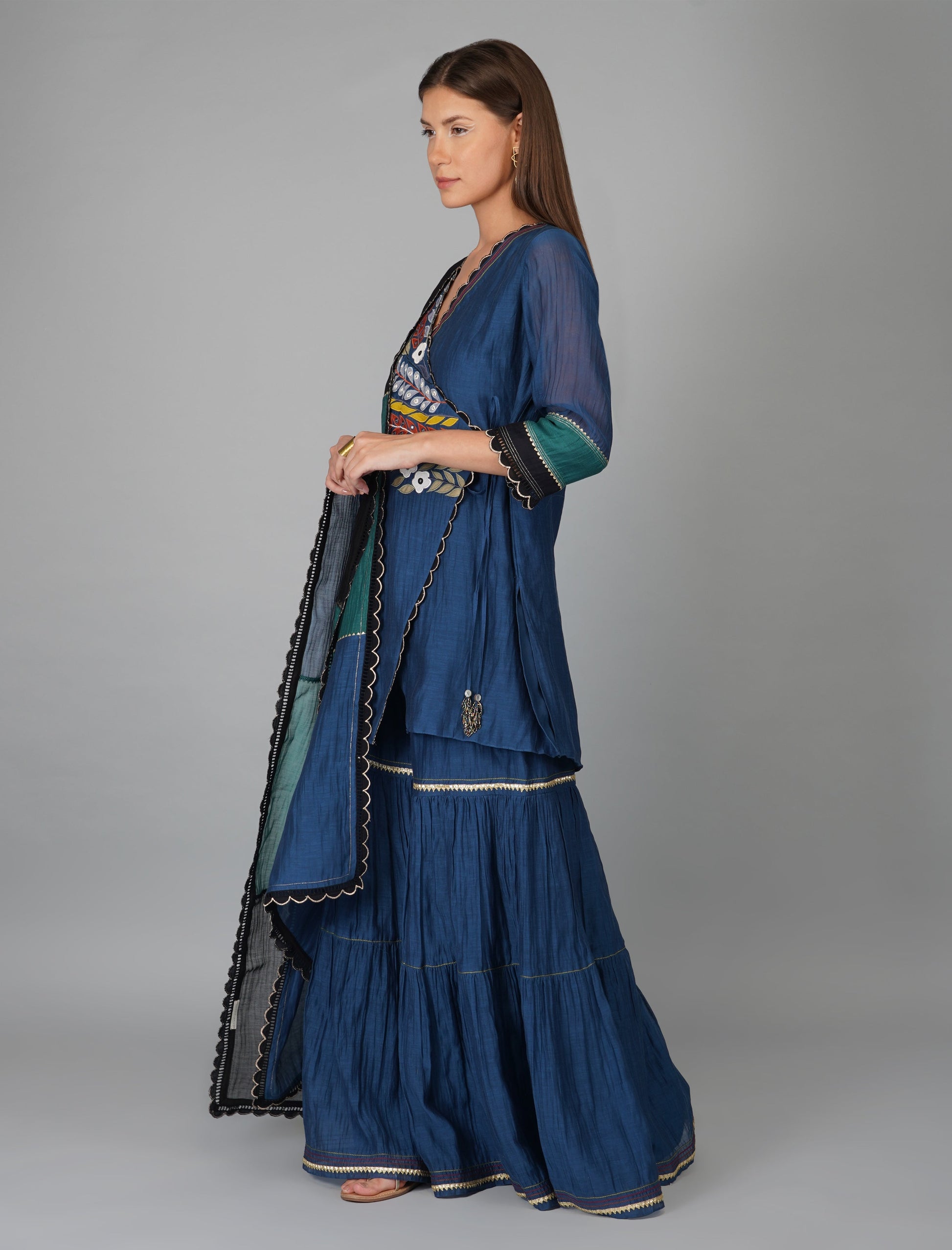 Blue Chanderi Asymmetric Wrap Gharara Set by Devyani Mehrotra with Blue, Chanderi Silk, Festive Wear, Georgette, Gharara Sets, Natural, Patchwork, Pre Spring 2023, Prints, Regular Fit, Womenswear at Kamakhyaa for sustainable fashion