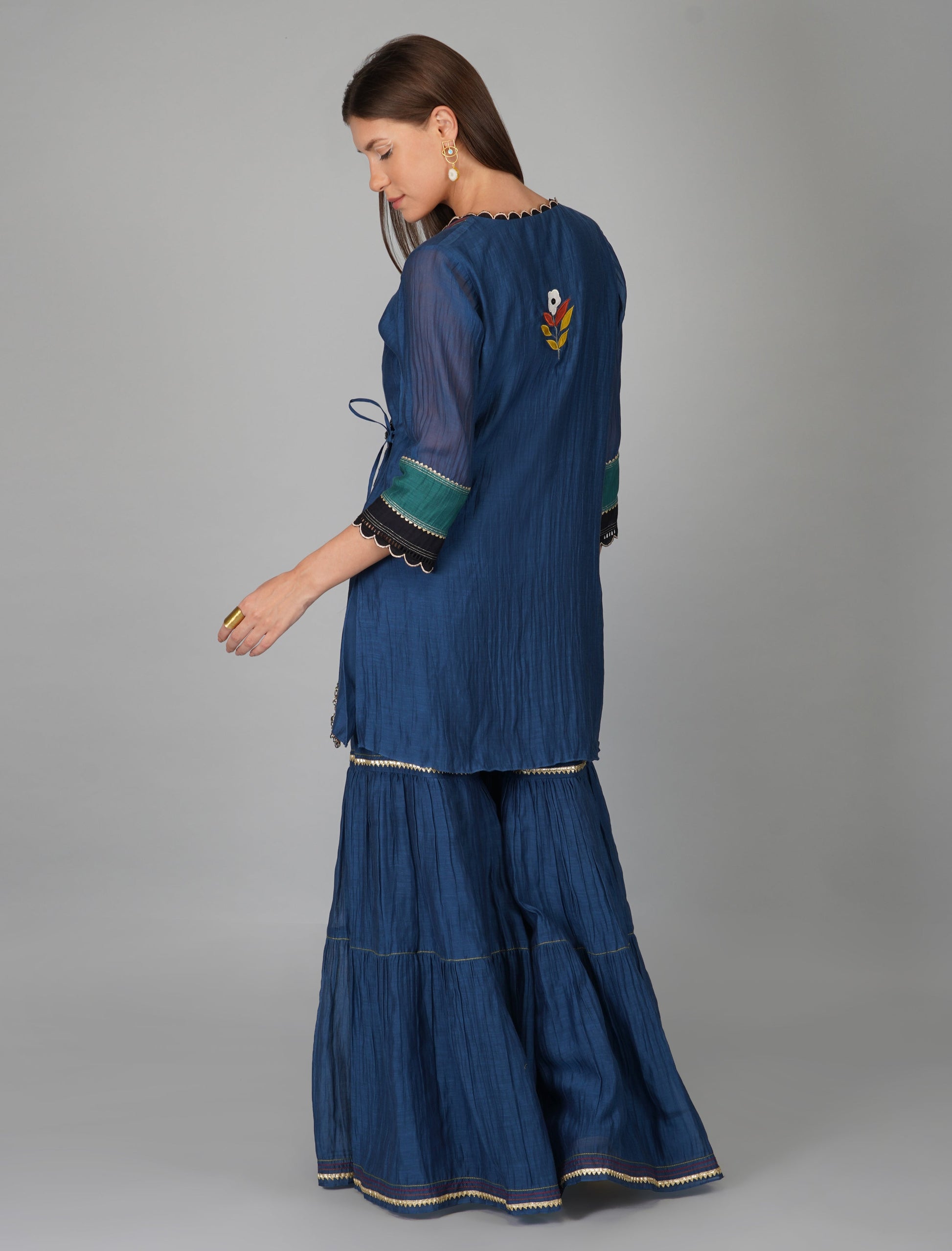 Blue Chanderi Asymmetric Wrap Gharara Set by Devyani Mehrotra with Blue, Chanderi Silk, Festive Wear, Georgette, Gharara Sets, Natural, Patchwork, Pre Spring 2023, Prints, Regular Fit, Womenswear at Kamakhyaa for sustainable fashion