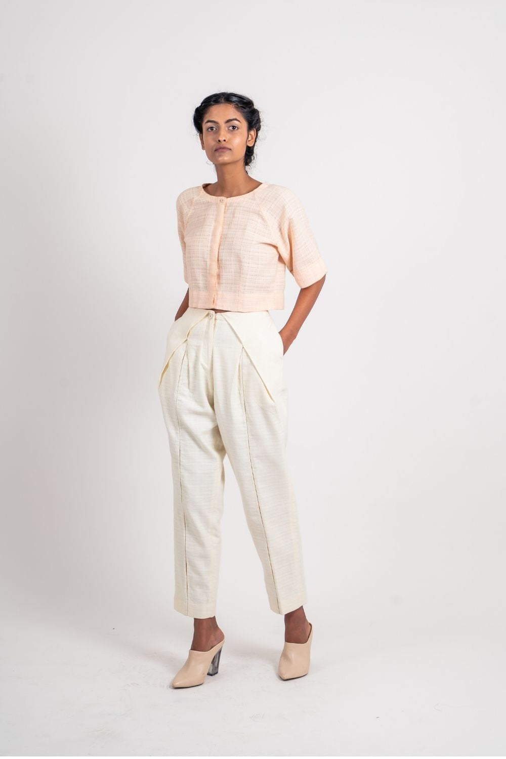 White Textured Pleated Pant by Ahmev with Broken Book by Ahmev, Casual Wear, Fitted At Waist, Handloom Cotton, Highend fashion, July Sale, July Sale 2023, Natural, Solids, Trousers, White, Womenswear at Kamakhyaa for sustainable fashion