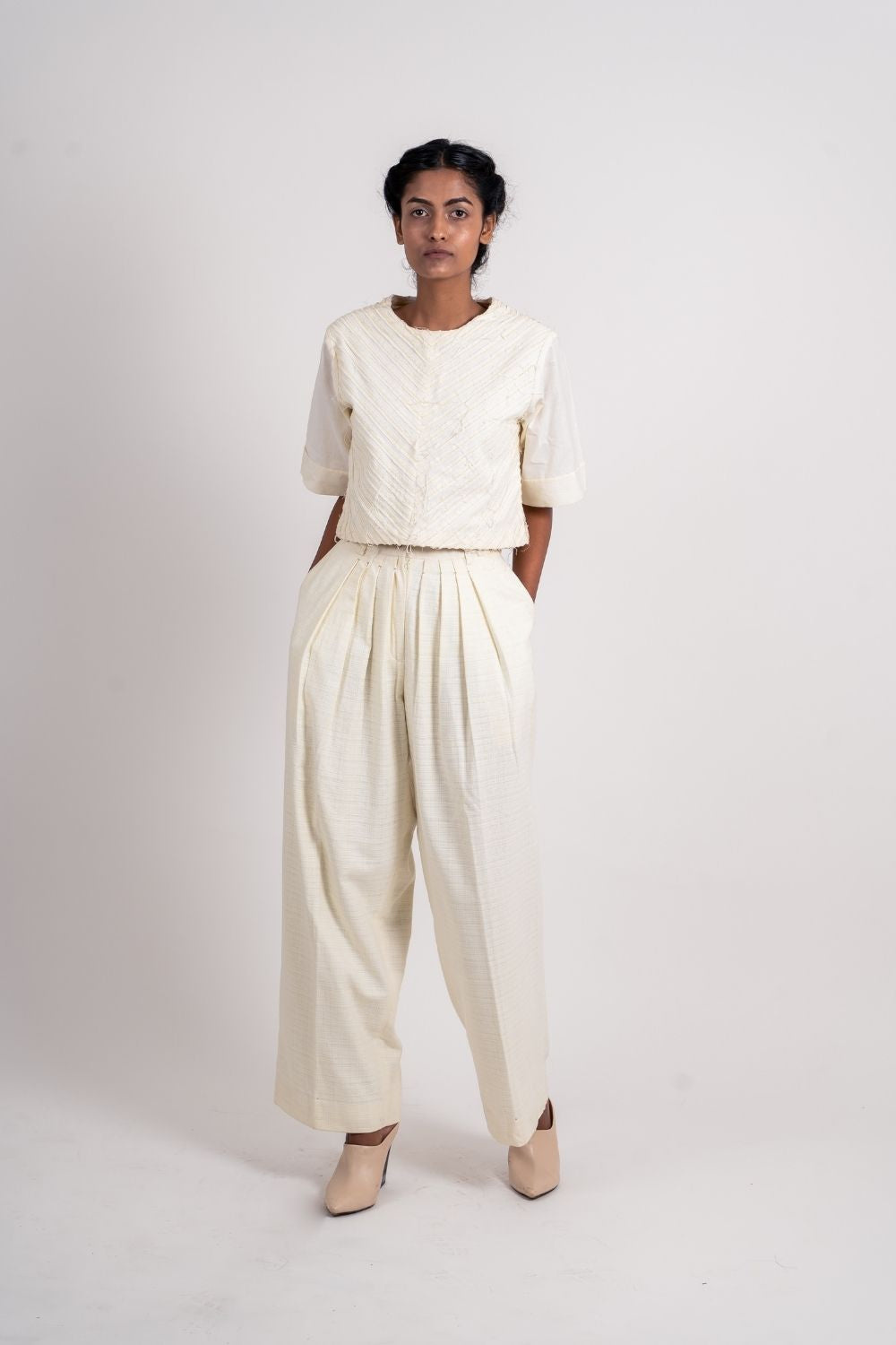 White Pleated Pants by Ahmev with Bottoms, Broken Book by Ahmev, Casual Wear, Fitted At Waist, Handloom Cotton, July Sale, July Sale 2023, Natural, Palazzo Pants, Textured, White, Womenswear at Kamakhyaa for sustainable fashion