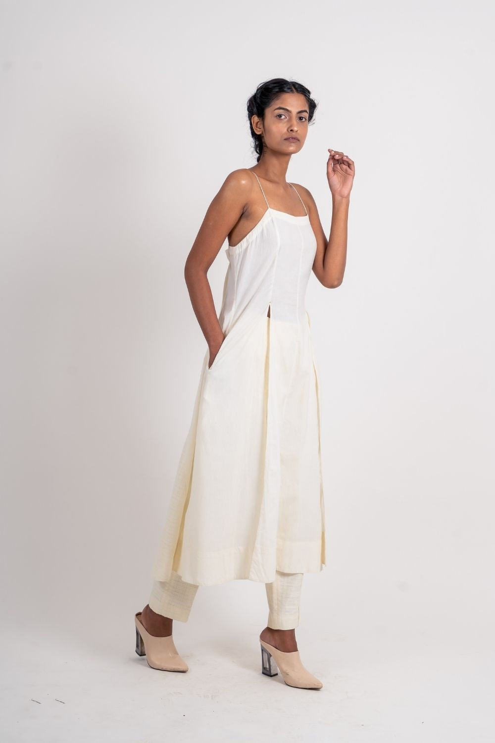 White Cotton Long Dress by Ahmev with Broken Book by Ahmev, Casual Wear, Handloom Cotton, July Sale, July Sale 2023, Midi Dresses, Natural, Relaxed Fit, Sleeveless Dresses, Solids, Strap Dresses, White, Womenswear at Kamakhyaa for sustainable fashion