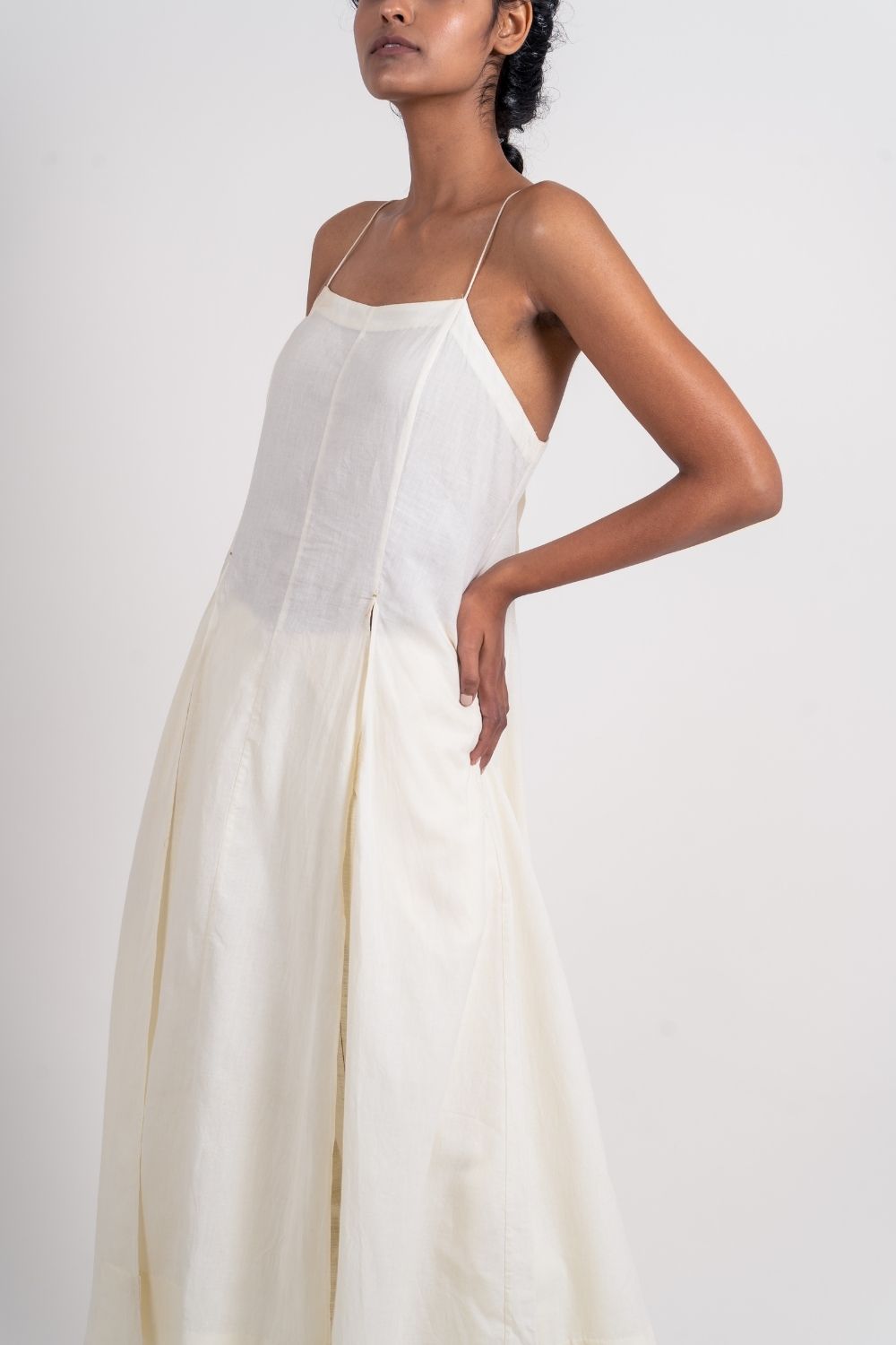 White Cotton Long Dress by Ahmev with Broken Book by Ahmev, Casual Wear, Handloom Cotton, July Sale, July Sale 2023, Midi Dresses, Natural, Relaxed Fit, Sleeveless Dresses, Solids, Strap Dresses, White, Womenswear at Kamakhyaa for sustainable fashion