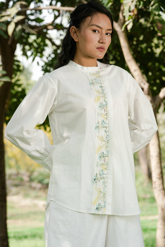 White Pleated placket shirt by Ahmev with Batik, Casual Wear, Cottage Garden, Cottage Garden by Ahmev, Cotton, Handpainted, July Sale, July Sale 2023, Natural, Prints, Regular Fit, Shirts, Tops, White, Womenswear at Kamakhyaa for sustainable fashion