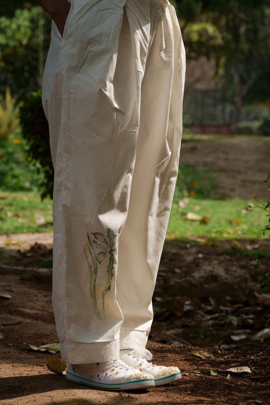 Ivory pleated pants by Ahmev with Batik, Casual Wear, Cottage Garden, Cottage Garden by Ahmev, Cotton, Fitted At Waist, Handpainted, July Sale, July Sale 2023, Natural, Pants, Solids, White, Womenswear at Kamakhyaa for sustainable fashion