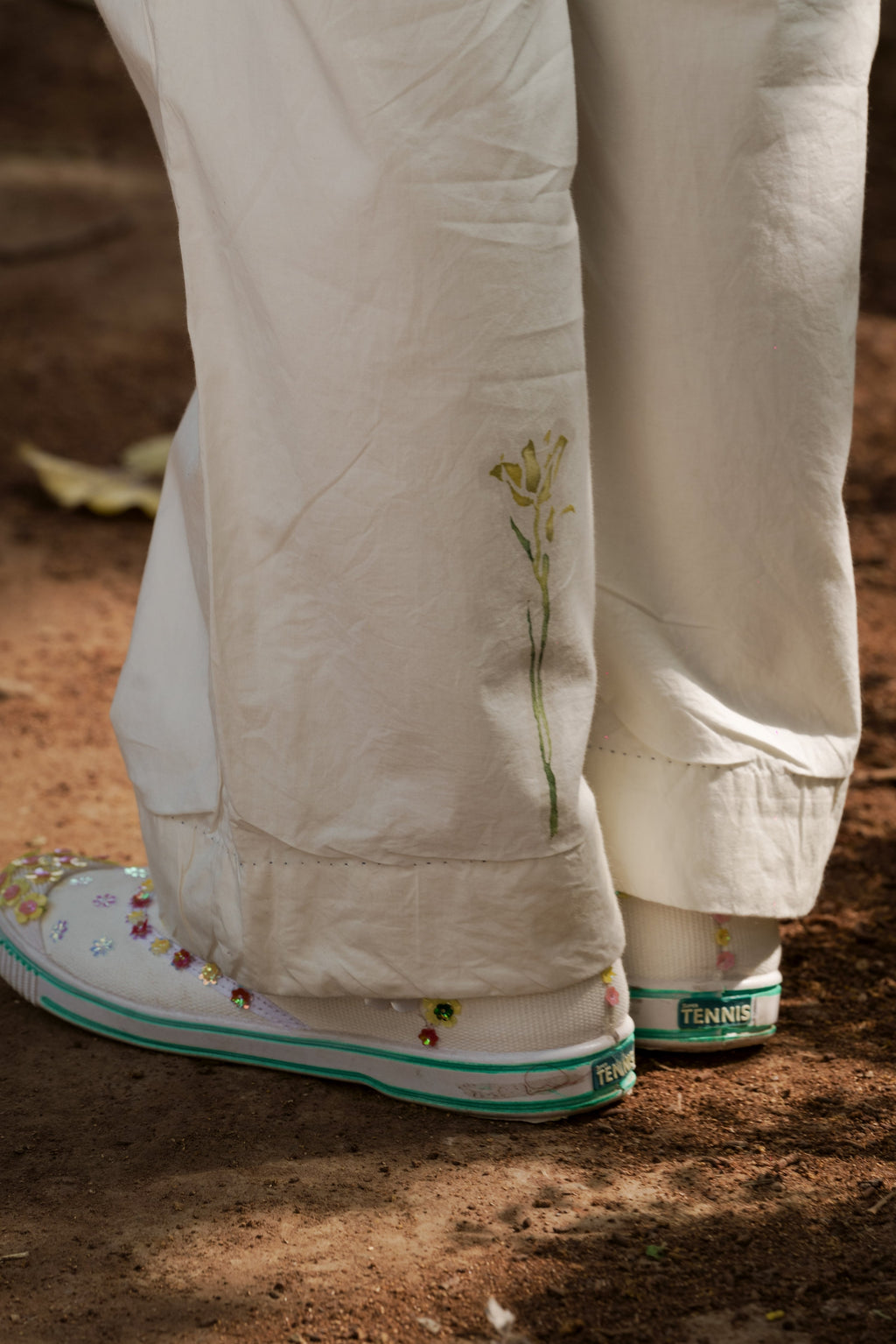 Ivory pleated pants by Ahmev with Batik, Casual Wear, Cottage Garden, Cottage Garden by Ahmev, Cotton, Fitted At Waist, Handpainted, July Sale, July Sale 2023, Natural, Pants, Solids, White, Womenswear at Kamakhyaa for sustainable fashion