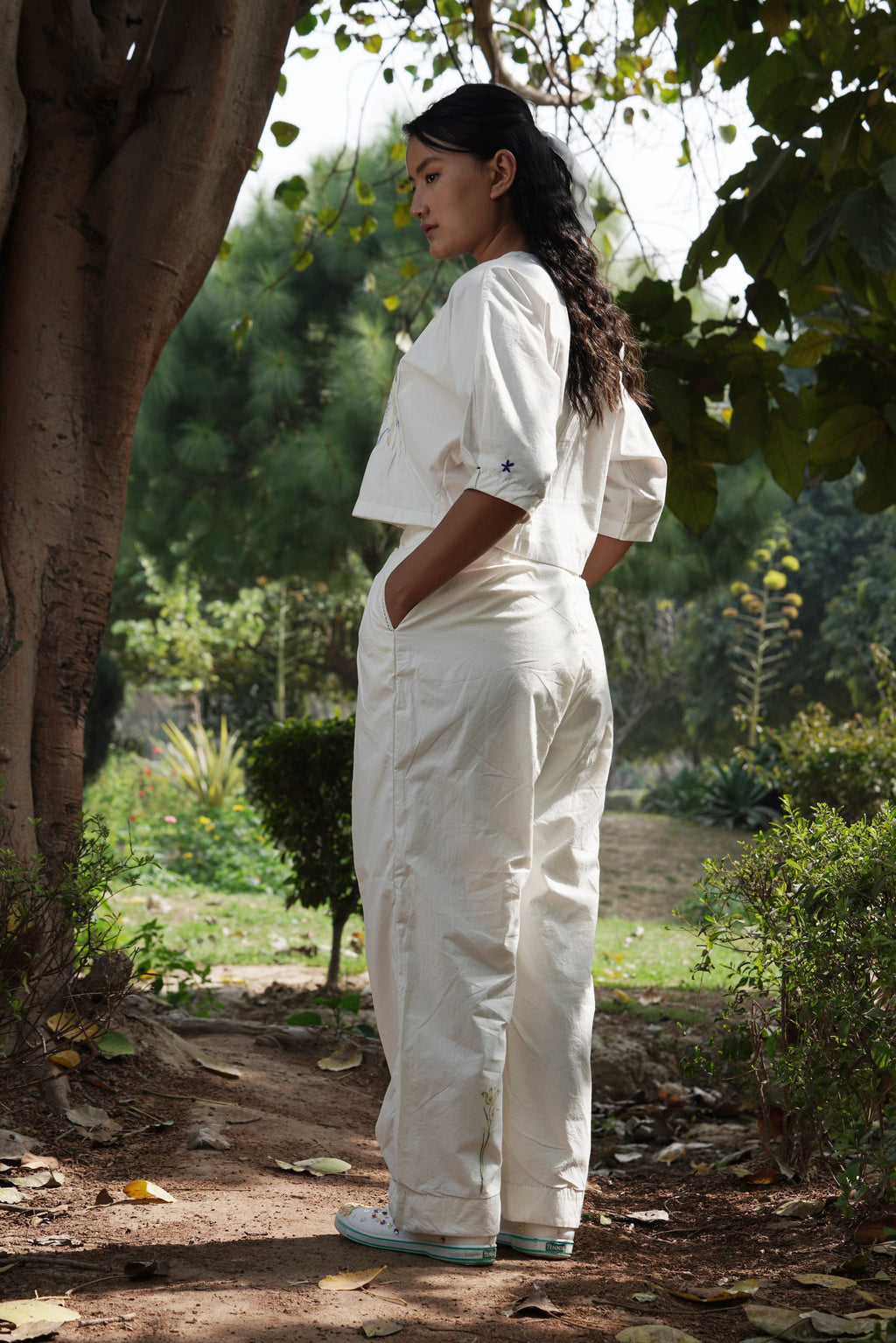 Ivory pleated pants by Ahmev with Batik, Casual Wear, Cottage Garden, Cottage Garden by Ahmev, Cotton, Fitted At Waist, Handpainted, July Sale, July Sale 2023, Natural, Pants, Solids, White, Womenswear at Kamakhyaa for sustainable fashion