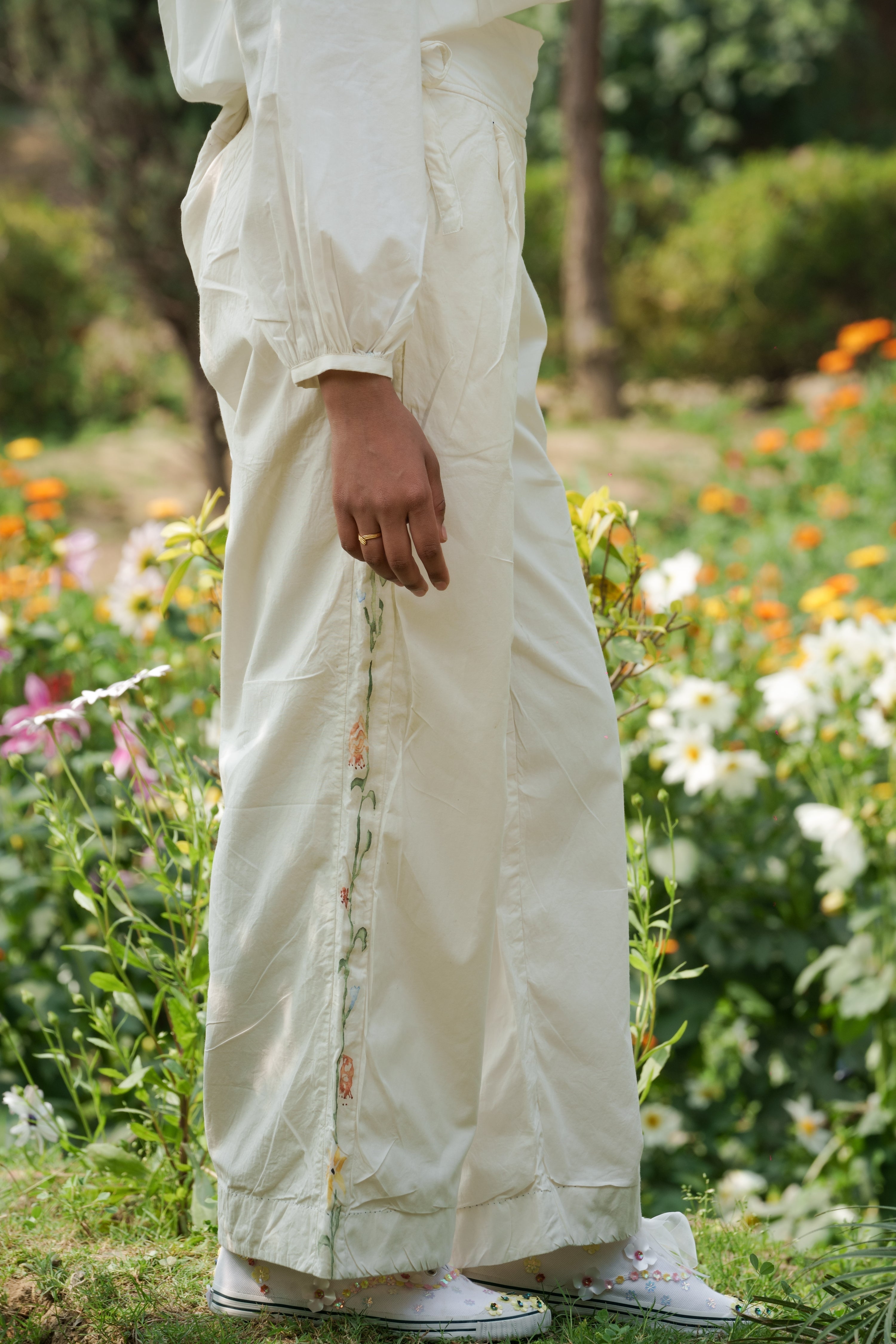 White Hand Painted Pants by Ahmev with Batik, Casual Wear, Cottage Garden, Cottage Garden by Ahmev, Cotton, Fitted At Waist, Handpainted, July Sale, July Sale 2023, Natural, Pants, Solids, White, Womenswear at Kamakhyaa for sustainable fashion