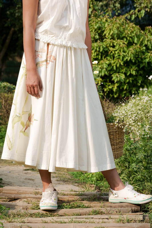 White Cotton circular skirt by Ahmev with Batik, Casual Wear, Cottage Garden, Cottage Garden by Ahmev, Cotton, Fitted At Waist, Hanpainted, July Sale, July Sale 2023, Midi Skirts, Natural, Prints, Skirts, White, Womenswear at Kamakhyaa for sustainable fashion