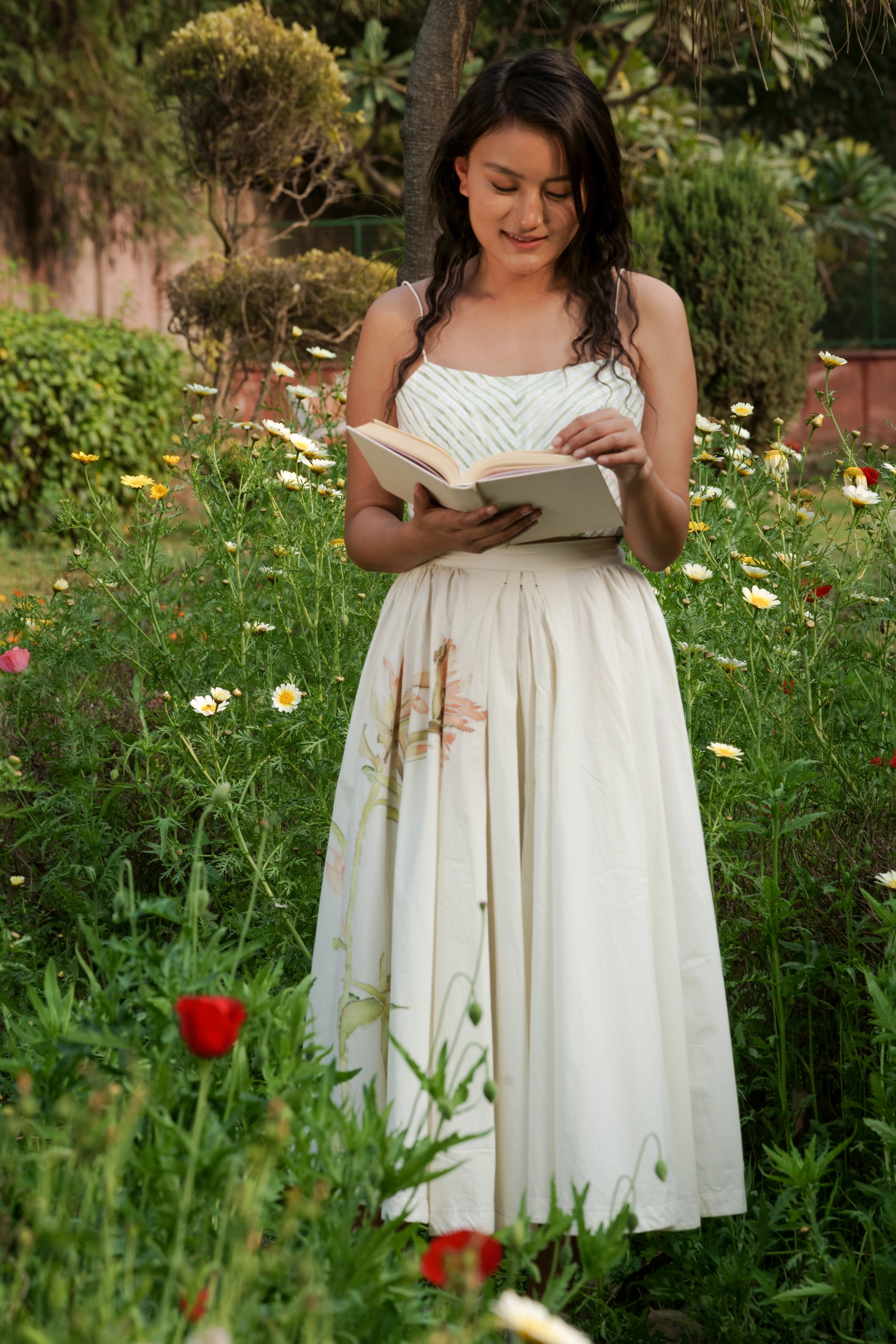 White Cotton circular skirt by Ahmev with Batik, Casual Wear, Cottage Garden, Cottage Garden by Ahmev, Cotton, Fitted At Waist, Hanpainted, July Sale, July Sale 2023, Midi Skirts, Natural, Prints, Skirts, White, Womenswear at Kamakhyaa for sustainable fashion