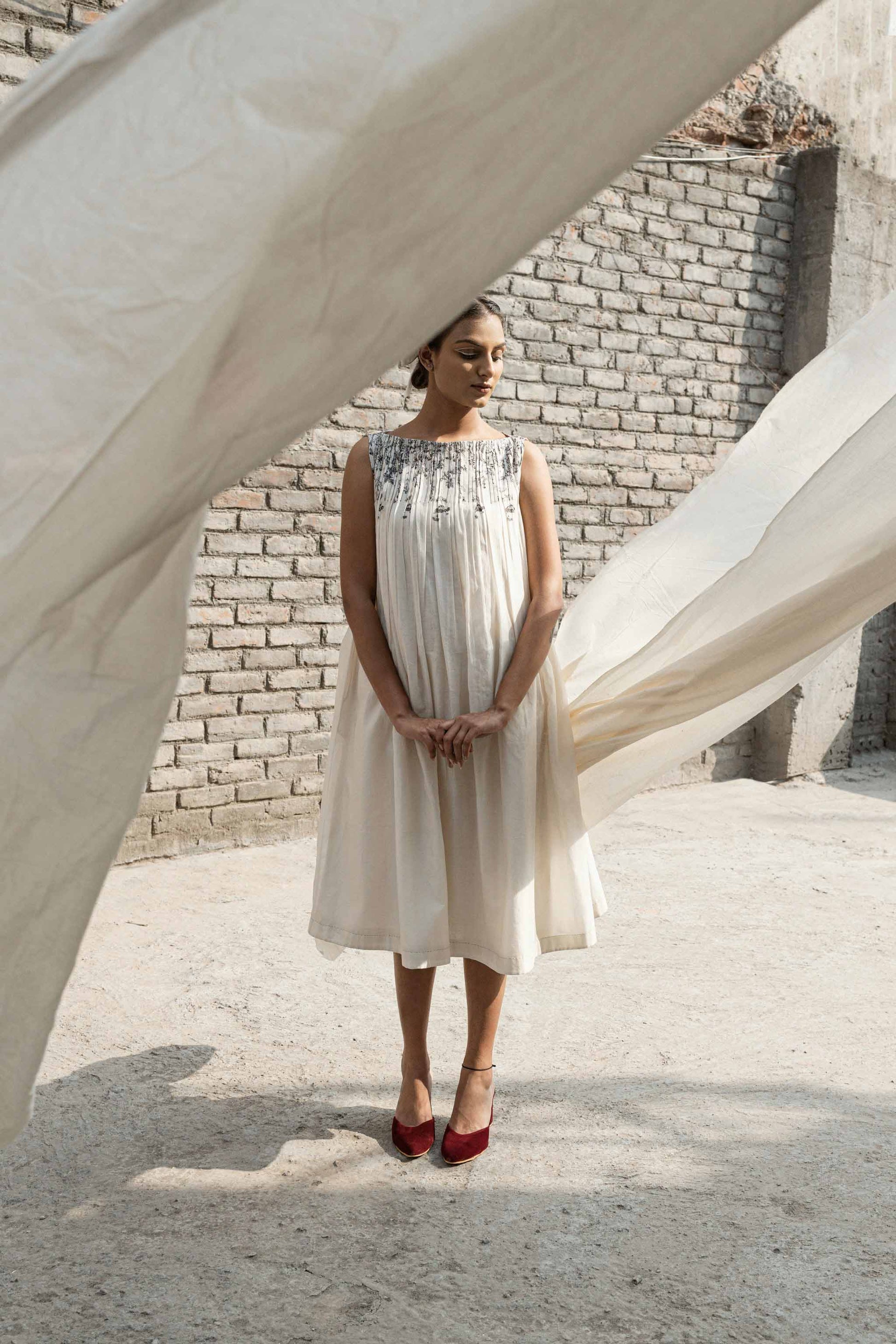 Ivory Pleated Neck Dress by Ahmev with Casual Wear, Chanderi, Ink And Ivory, Ink And Ivory by Ahmev, Midi Dresses, Natural, Prints, Regular Fit, Sleeveless Dresses, White, Womenswear at Kamakhyaa for sustainable fashion