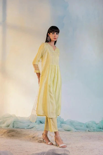 Yellow Cotton Kurta Set With Dupatta by Charkhee with Aasma by Charkhee, Aasmaa by Charkhee, Chanderi, Cotton, Embellished, Indian Wear, Kurta Pant Sets, Kurta Set With Dupatta, Natural, Relaxed Fit, Sequin work, Wedding Wear, Womenswear, Yellow at Kamakhyaa for sustainable fashion