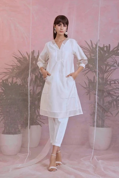 White Cotton Kurta Set With Organza Dupatta by Charkhee with Aasma by Charkhee, Aasmaa by Charkhee, Chanderi, Cotton, Embellished, Indian Wear, Kurta Pant Sets, Kurta Set With Dupatta, Natural, Organza, Relaxed Fit, Sequin work, Wedding Wear, White, Womenswear at Kamakhyaa for sustainable fashion