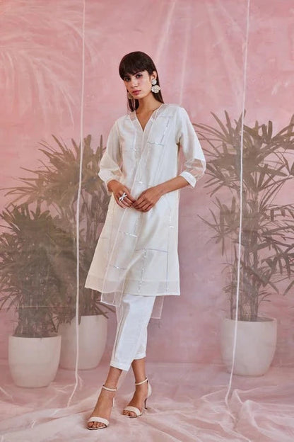 White Cotton Kurta Set With Organza Dupatta by Charkhee with Aasma by Charkhee, Aasmaa by Charkhee, Chanderi, Cotton, Embellished, Indian Wear, Kurta Pant Sets, Kurta Set With Dupatta, Natural, Organza, Relaxed Fit, Sequin work, Wedding Wear, White, Womenswear at Kamakhyaa for sustainable fashion