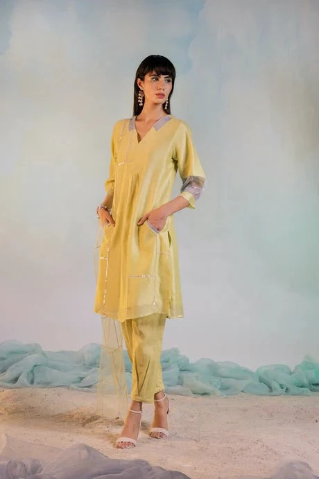 Yellow Cotton Kurta Set With Organza Dupatta by Charkhee with Aasma by Charkhee, Aasmaa by Charkhee, Chanderi, Cotton, Embellished, Indian Wear, Kurta Pant Sets, Kurta Set With Dupatta, Natural, Organza, Relaxed Fit, Sequin work, Wedding Wear, Womenswear, Yellow at Kamakhyaa for sustainable fashion