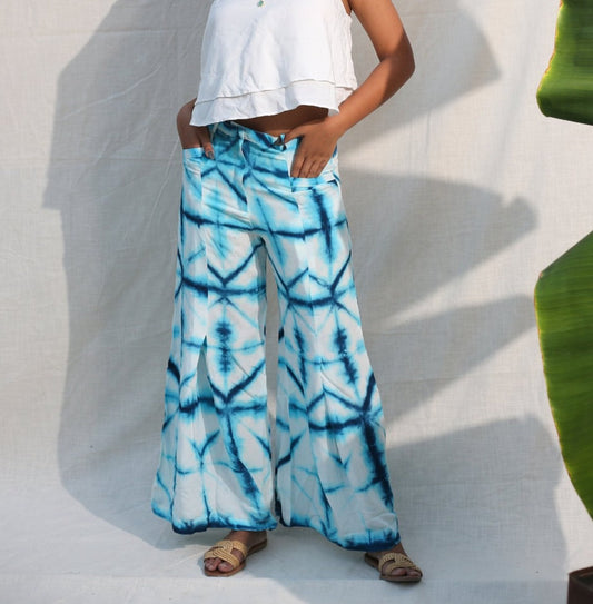 Blue And White Bell Bottom Pants by Keva with Blue, Day Dream, Natural, Palazzo Pants, Rayon, Relaxed Fit, Resort Wear, Tie & Dye, Womenswear at Kamakhyaa for sustainable fashion