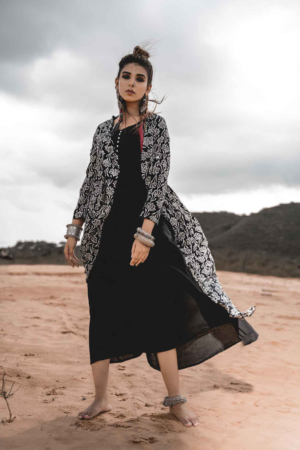 Black Rayon Dress With Cotton Block Printed Asymmetric Cape - Set Of 2 by Keva with Black, Block Prints, Cape, Co-ord Sets, Cotton, Dress Sets, For Mother, For Mother W, Jackets, Midi Dresses, Natural, Relaxed Fit, Resort Wear, Wild Child, Womenswear at Kamakhyaa for sustainable fashion