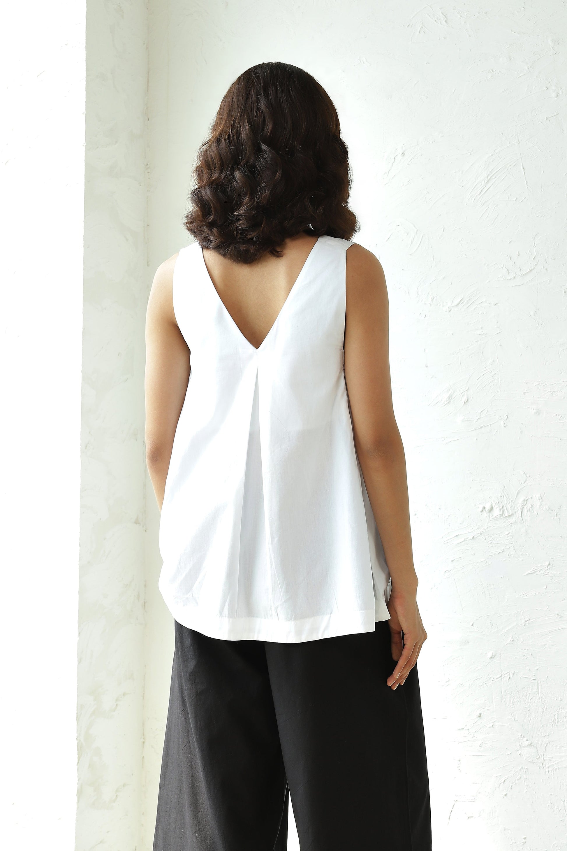White Sleeveless V Neck Top With Black Flared Pant Set by Canoopi with Black, Canoopi, Casual Wear, Complete Sets, Natural, Poplin, Regular Fit, Solids, Vacation Co-ords, White, Womenswear at Kamakhyaa for sustainable fashion