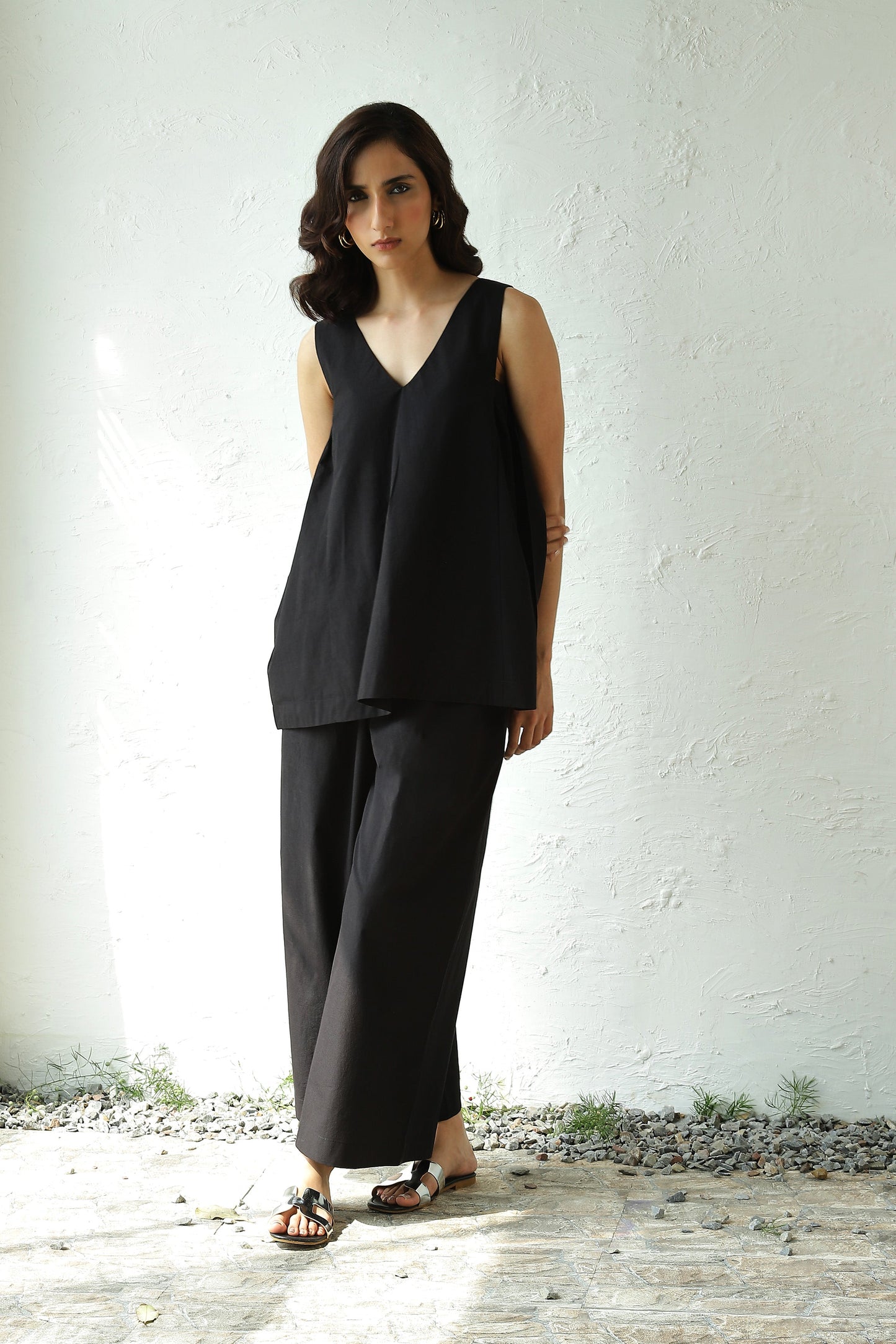 Black Sleeveless V Neck Top With Black Flared Pant Set by Canoopi with Black, Canoopi, Casual Wear, Complete Sets, Natural, Poplin, Regular Fit, Solids, Vacation Co-ords, Womenswear at Kamakhyaa for sustainable fashion